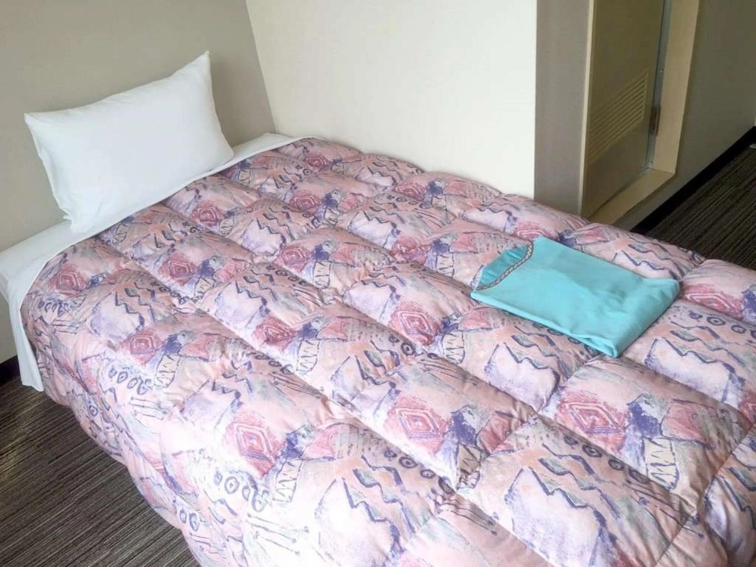 Bed in Hotel Niihama Hills Prince House