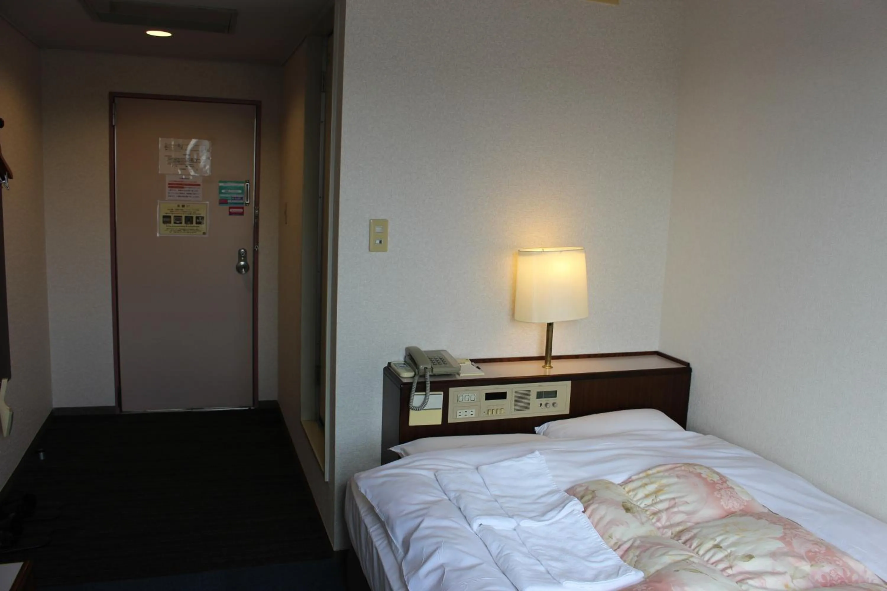 Bed in Hotel Higashihiroshima Hills Saijo