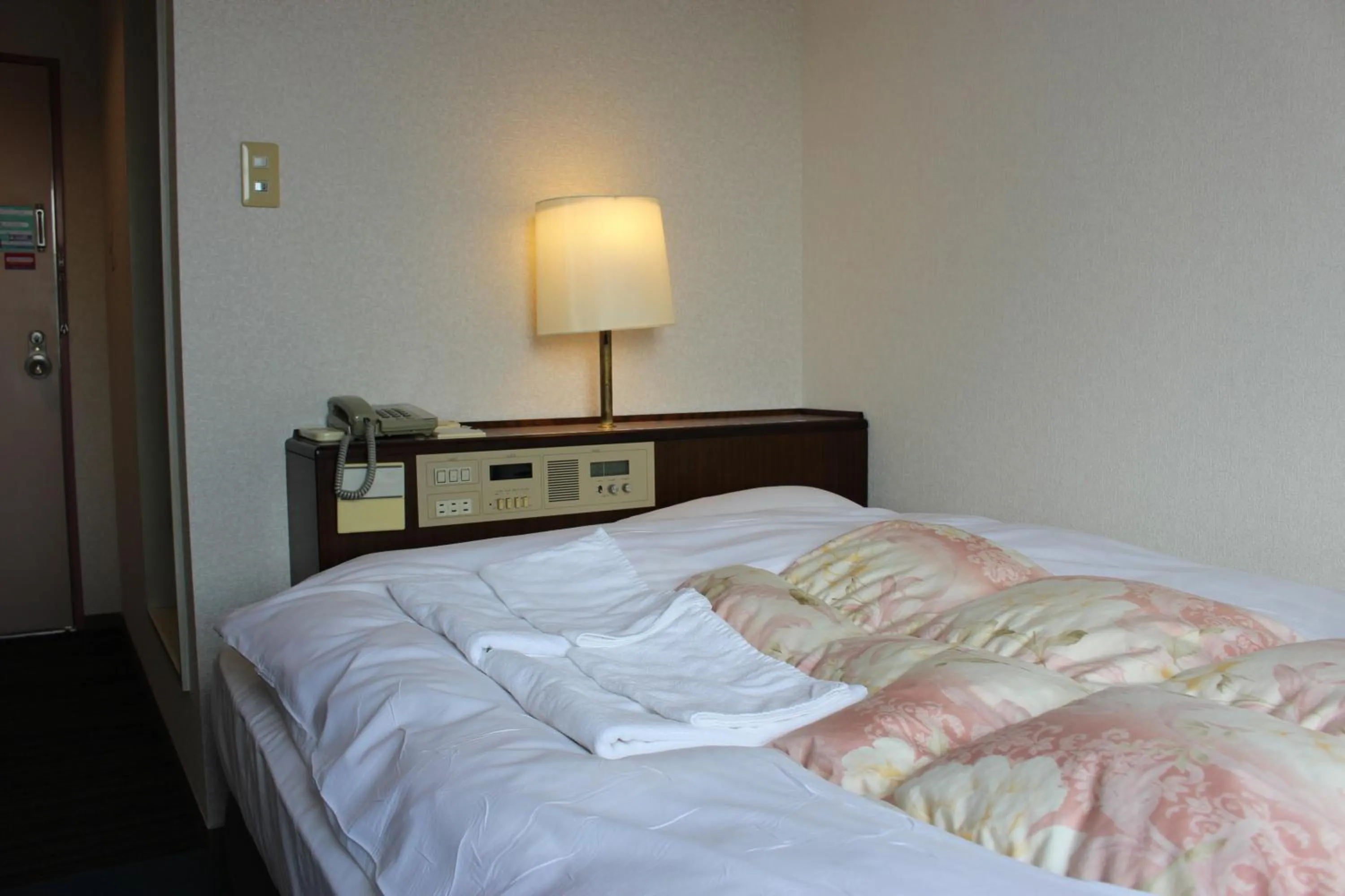 Bed in Hotel Higashihiroshima Hills Saijo