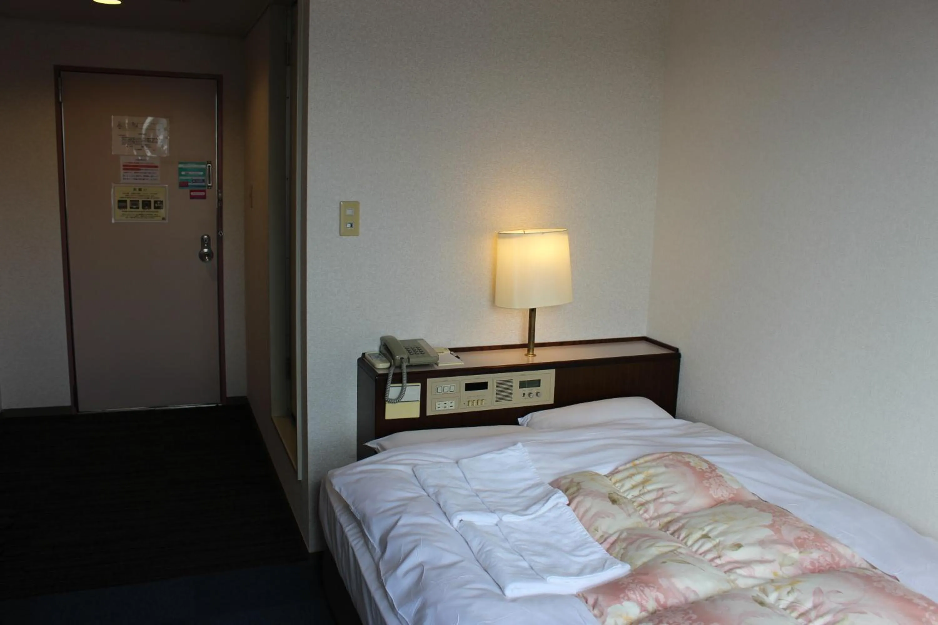 Bed in Hotel Higashihiroshima Hills Saijo