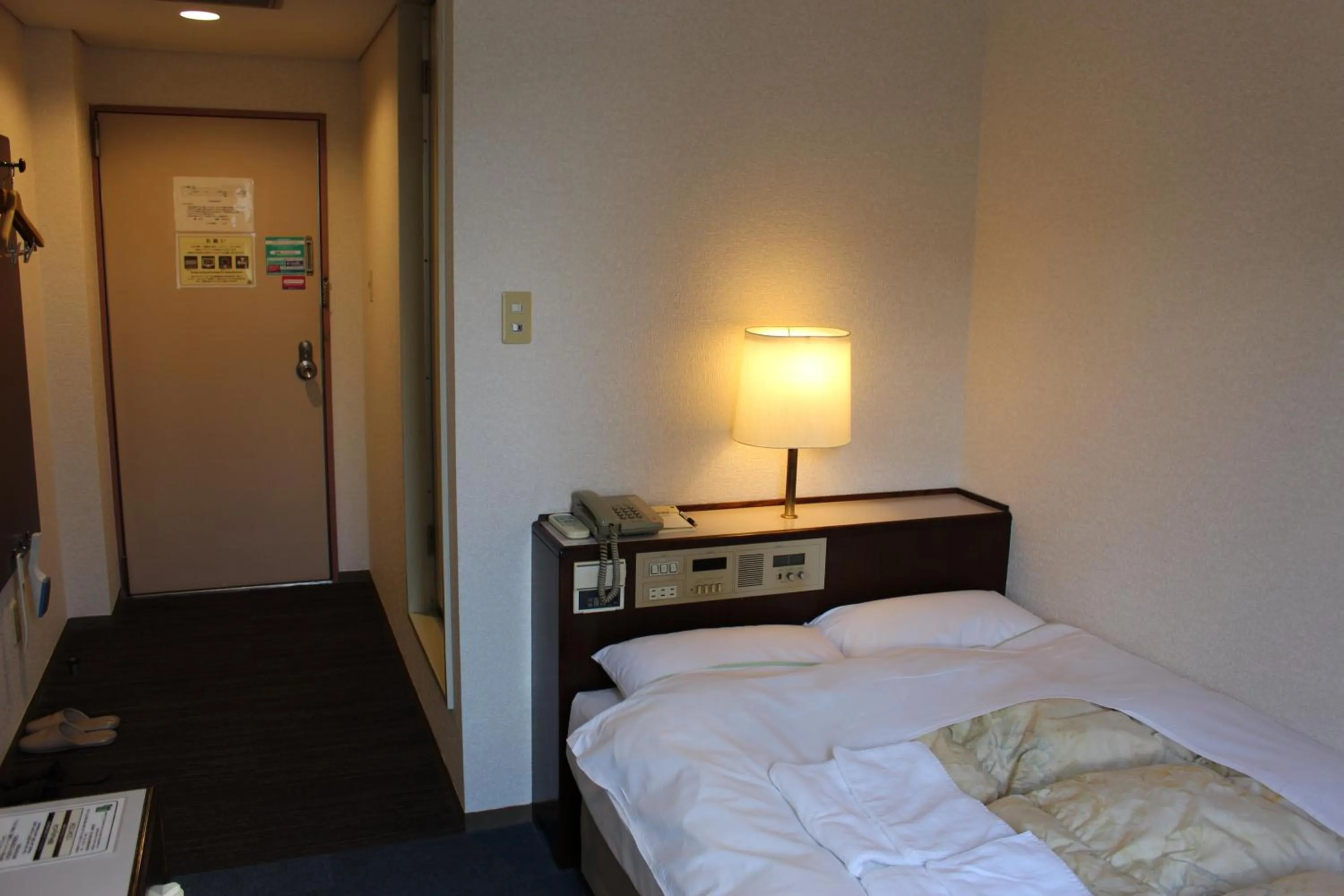 Bed in Hotel Higashihiroshima Hills Saijo