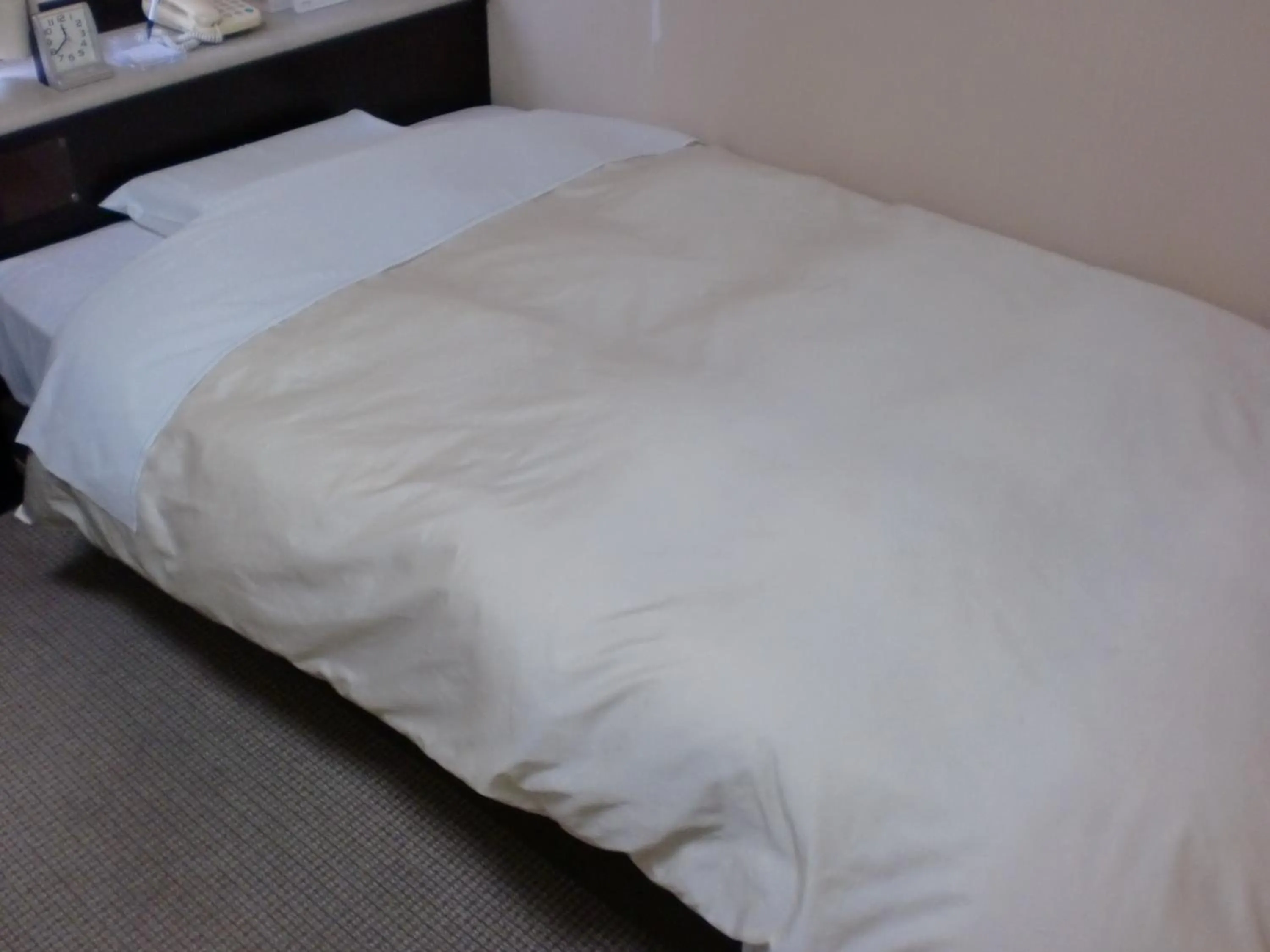 Bed in Tsuyama Central Hotel Townhouse