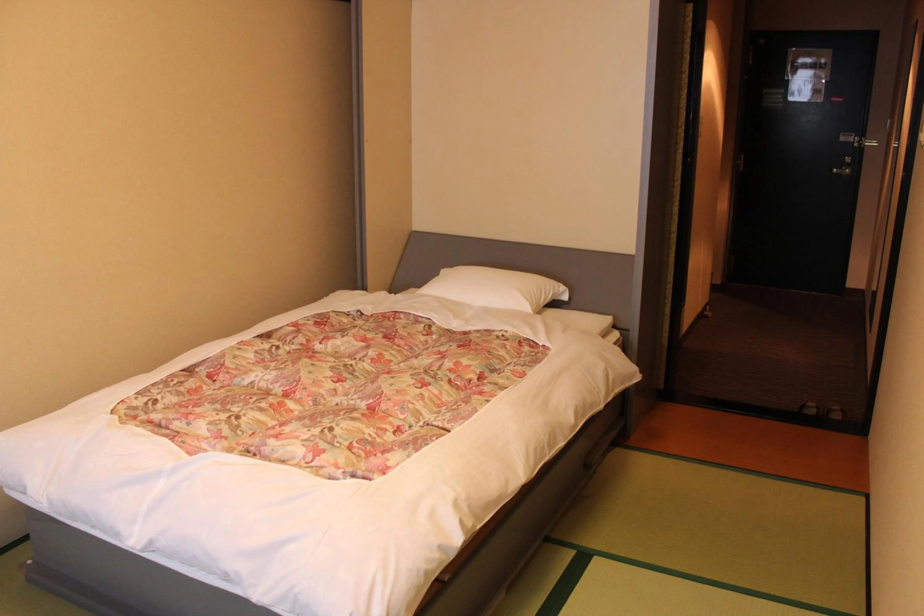 Photo of the whole room, Bed in Hotel Crown Hills Takaoka