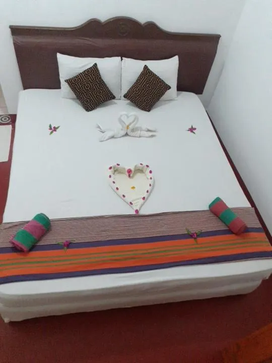 Bed in Nilaveli Beach Rooms