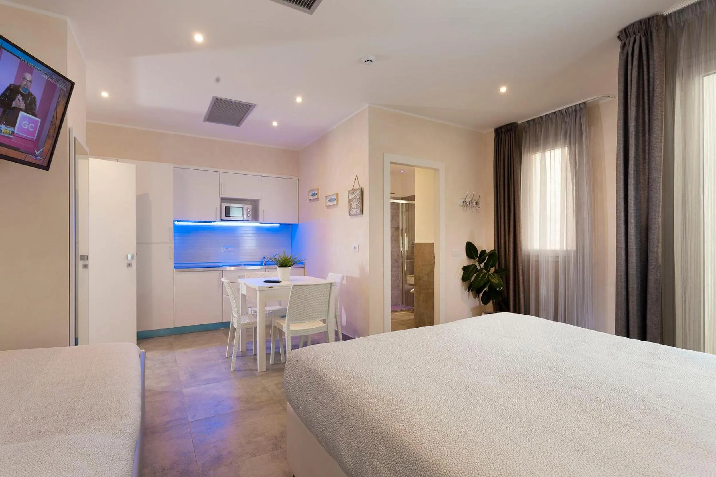 Bed in White Suite & Apartments