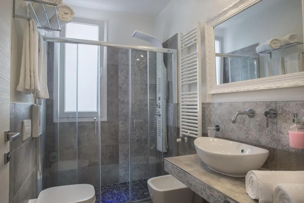 Bathroom in White Suite & Apartments