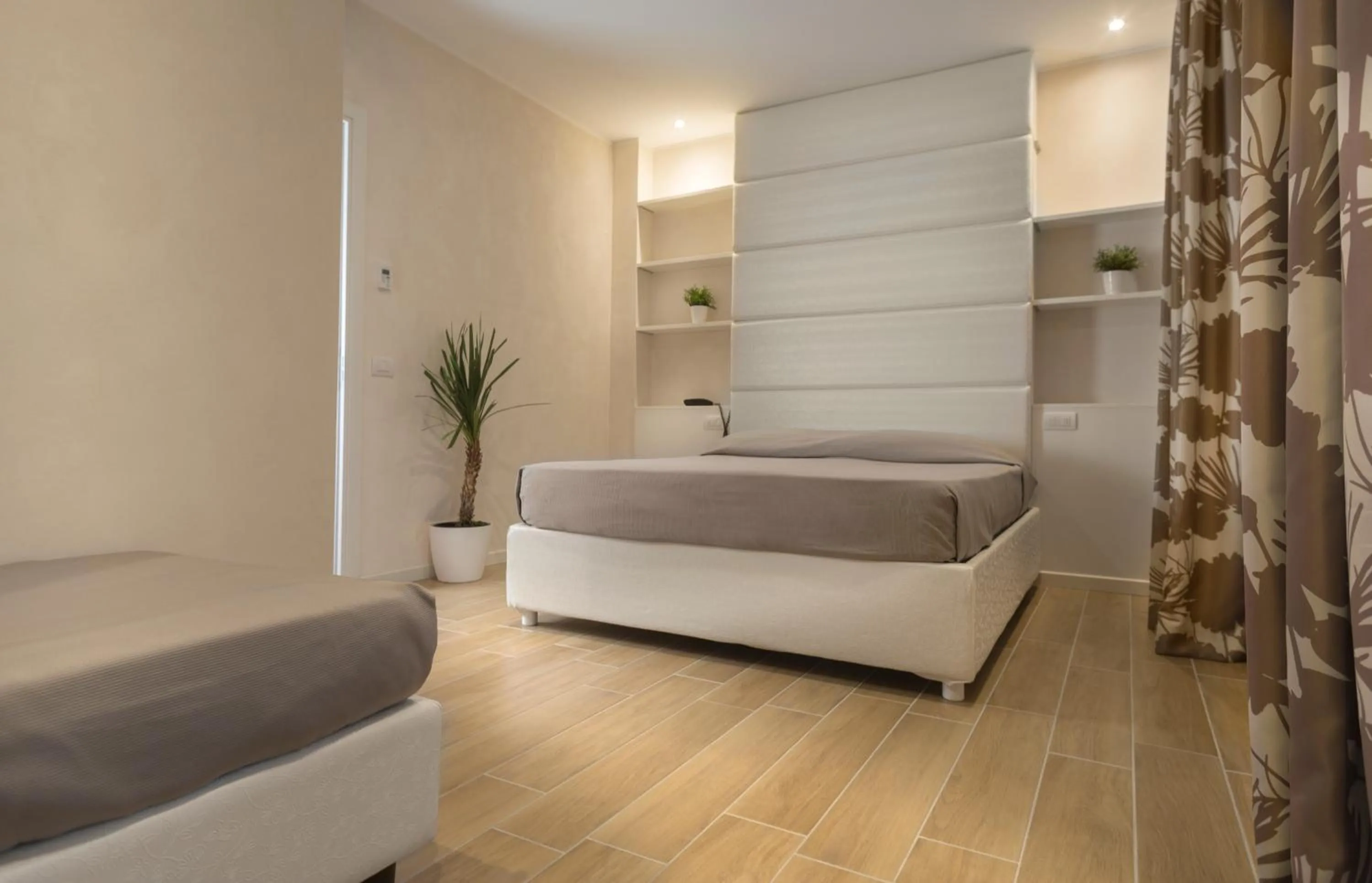 Bed in White Suite & Apartments