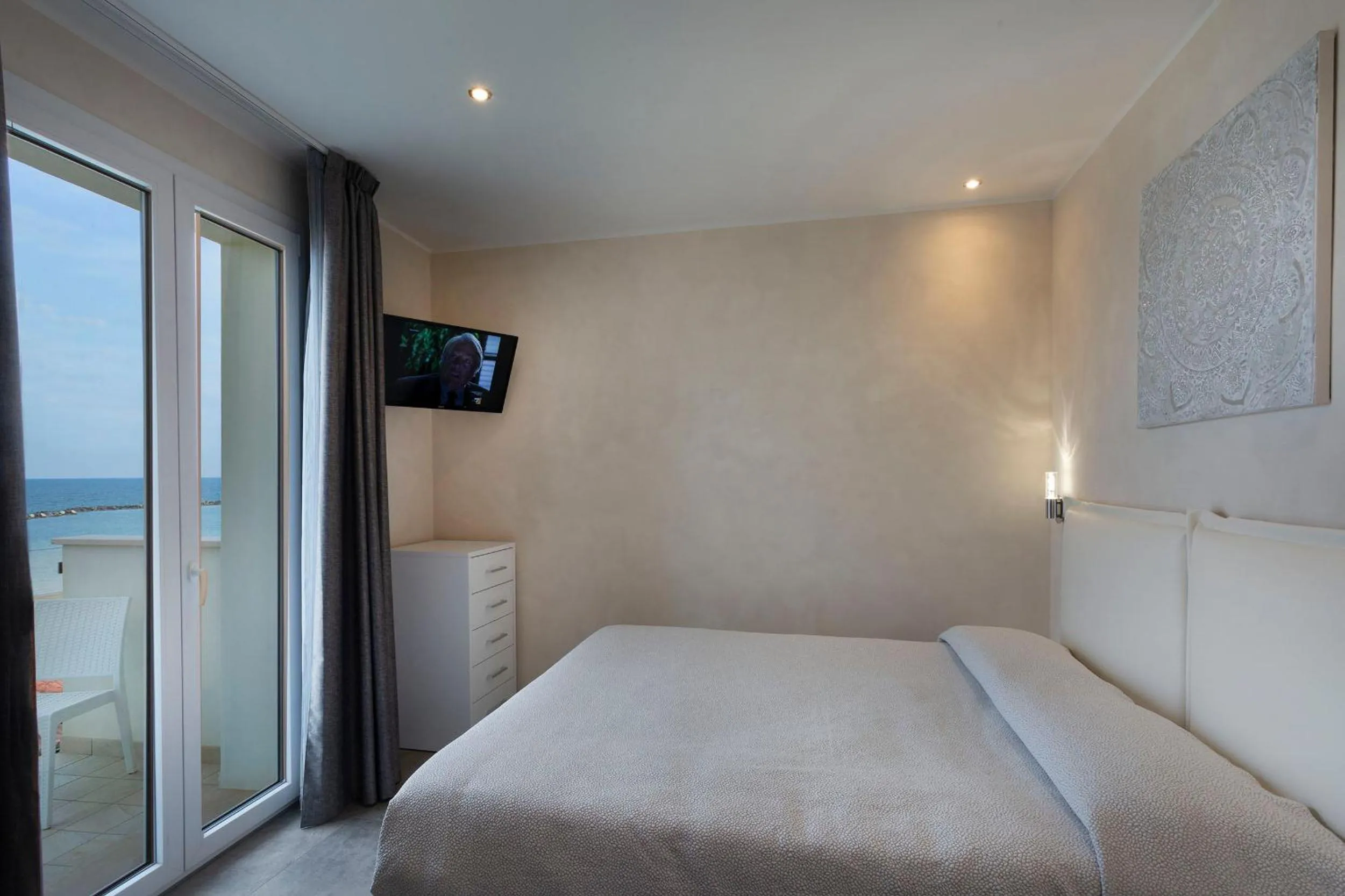 Bed in White Suite & Apartments