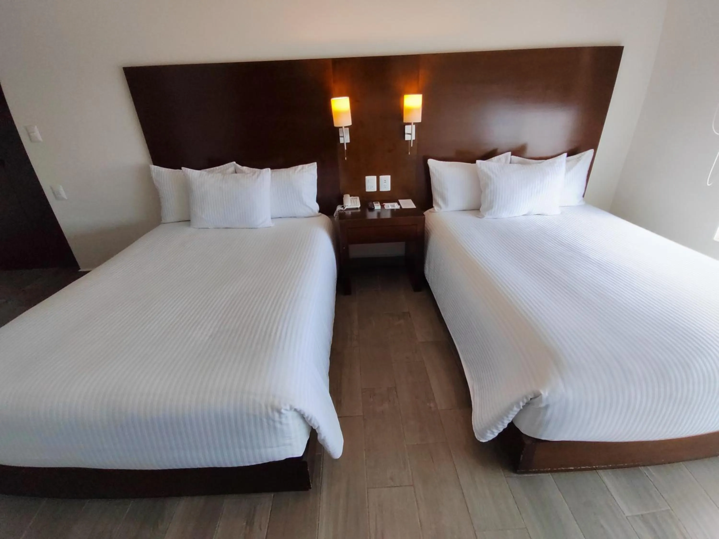 Photo of the whole room, Bed in Ramada by Wyndham Tampico Centro