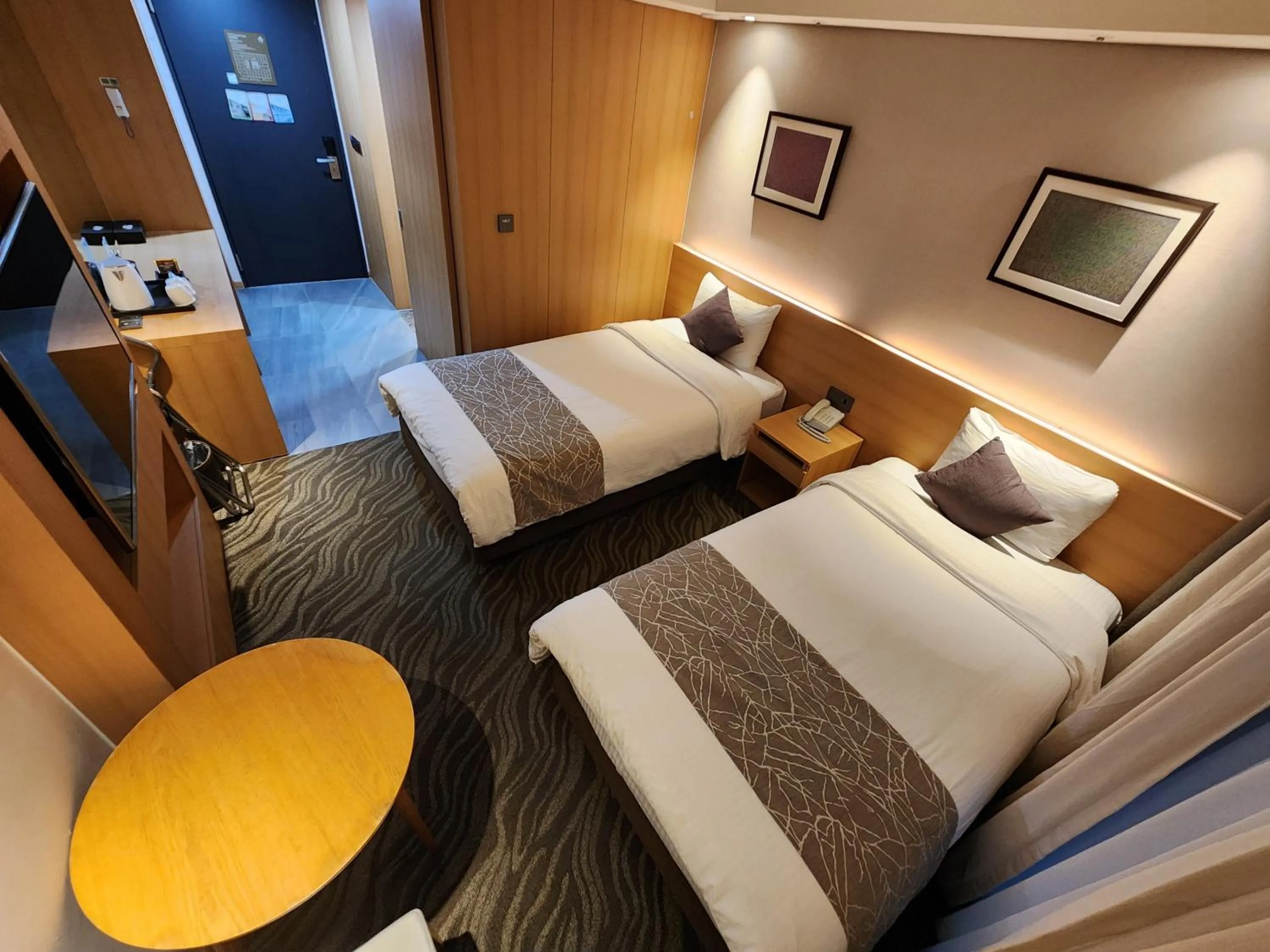 Bed in Seogwipo JS Hotel