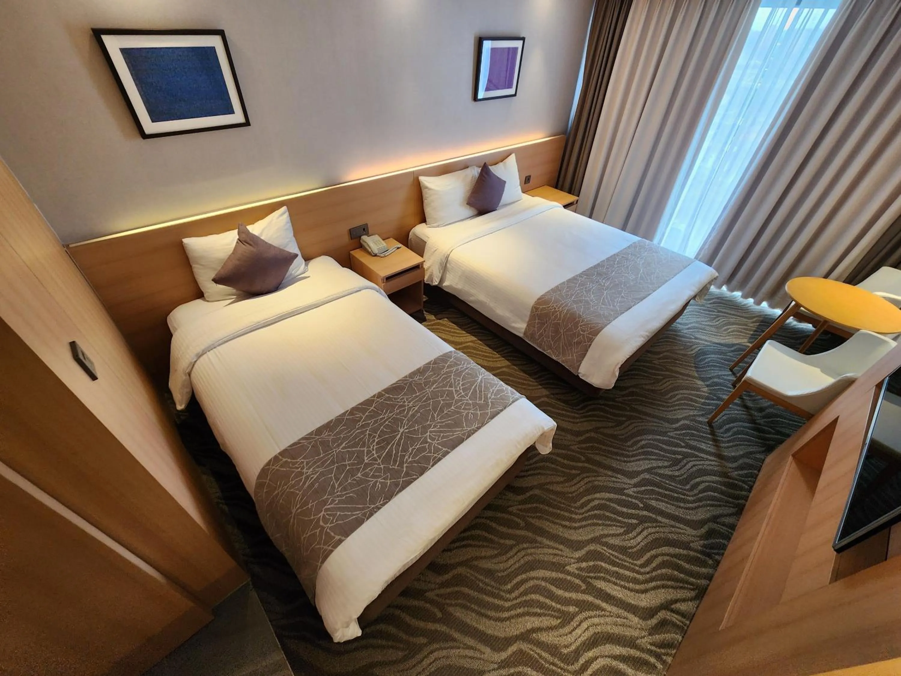 Bed in Seogwipo JS Hotel