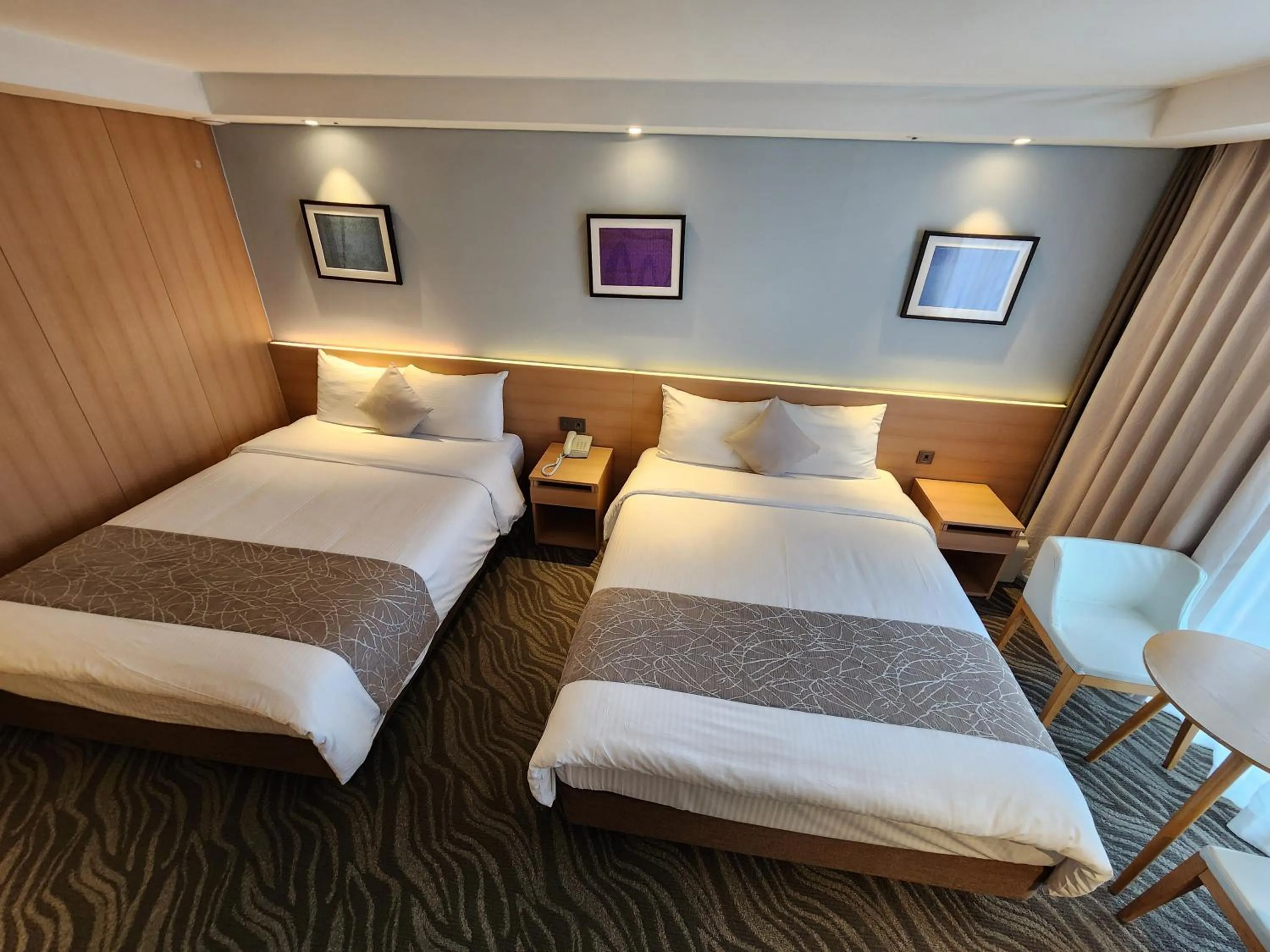 Bed in Seogwipo JS Hotel