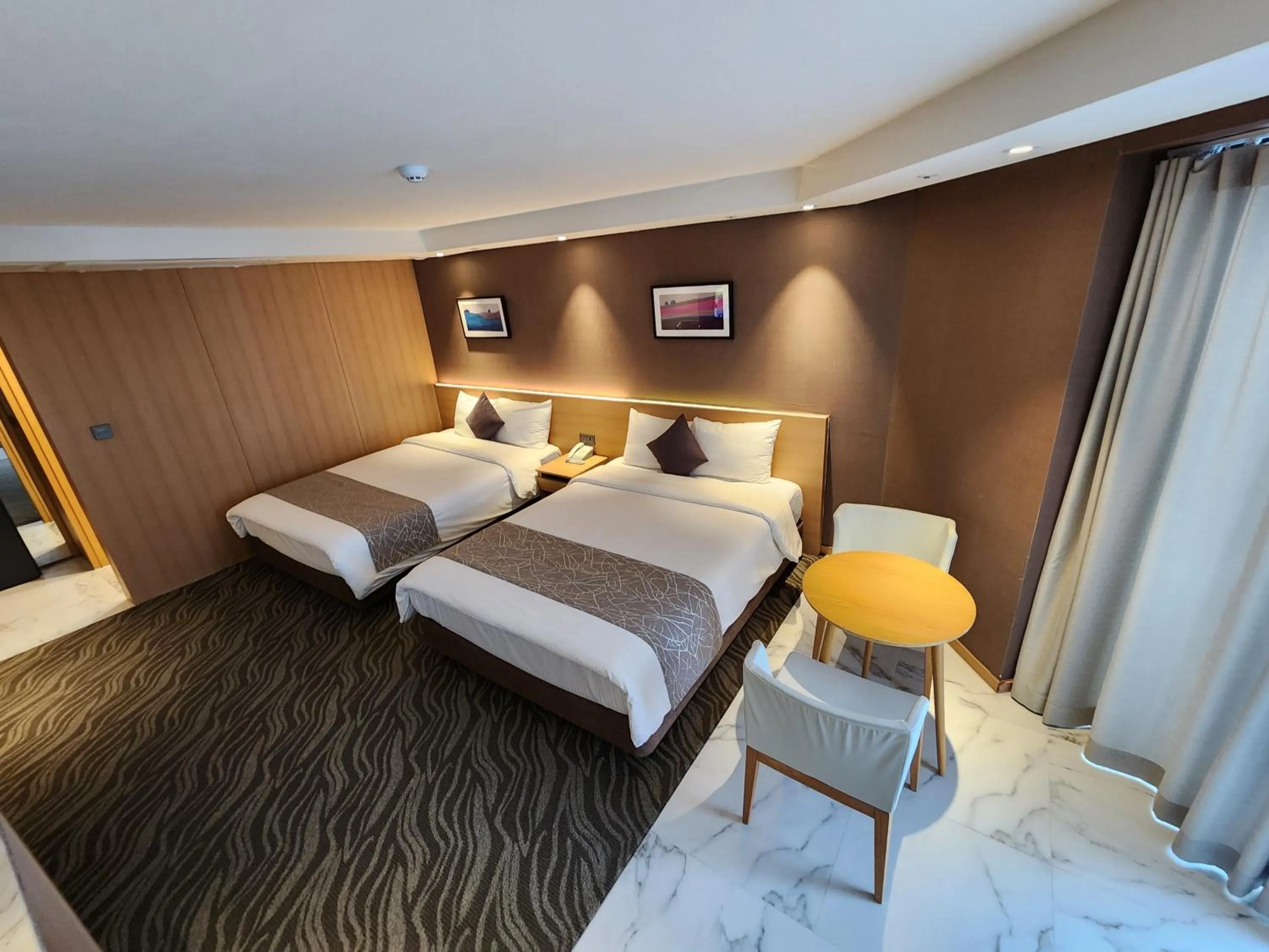 Bed in Seogwipo JS Hotel