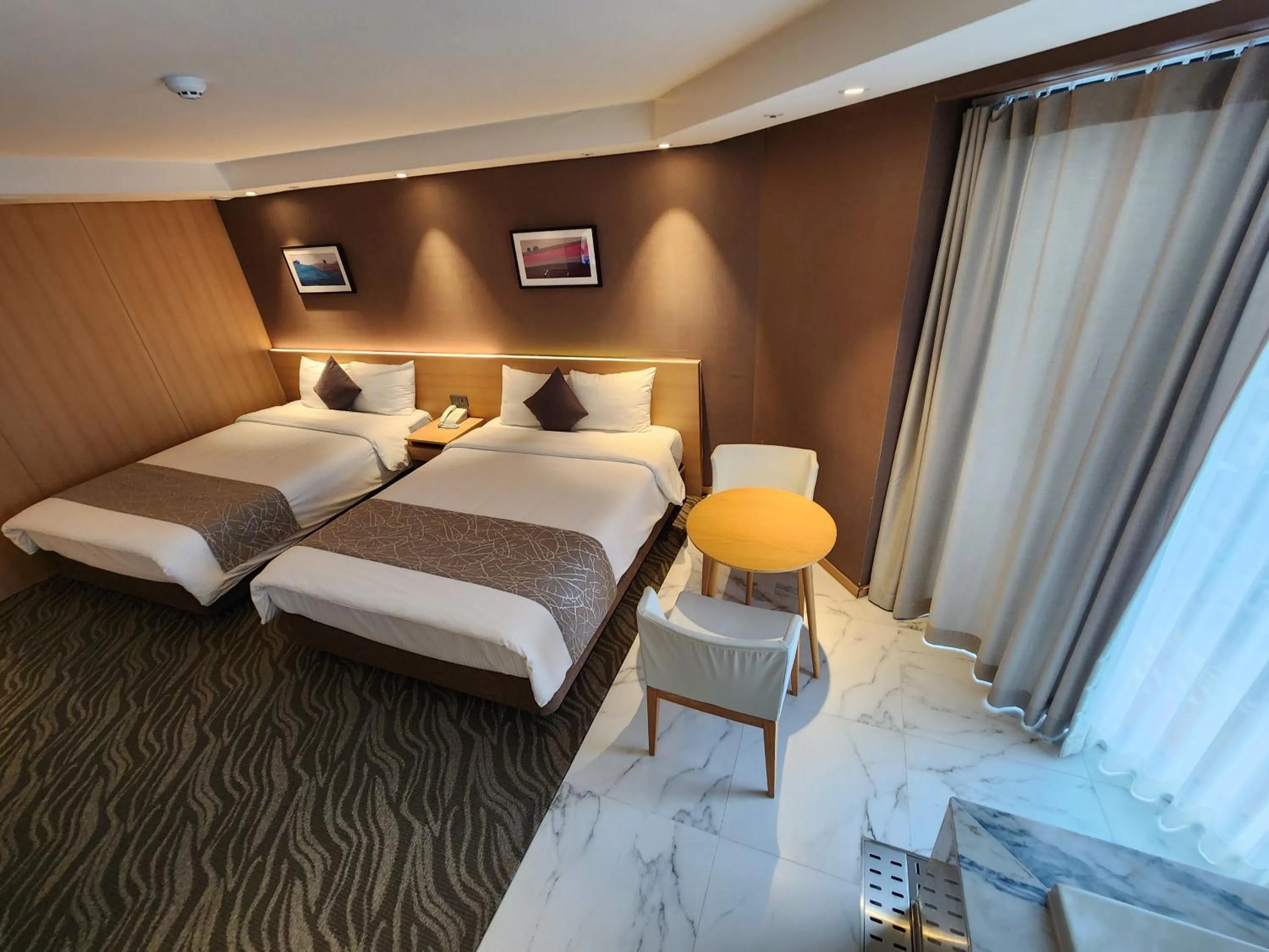 Bed in Seogwipo JS Hotel