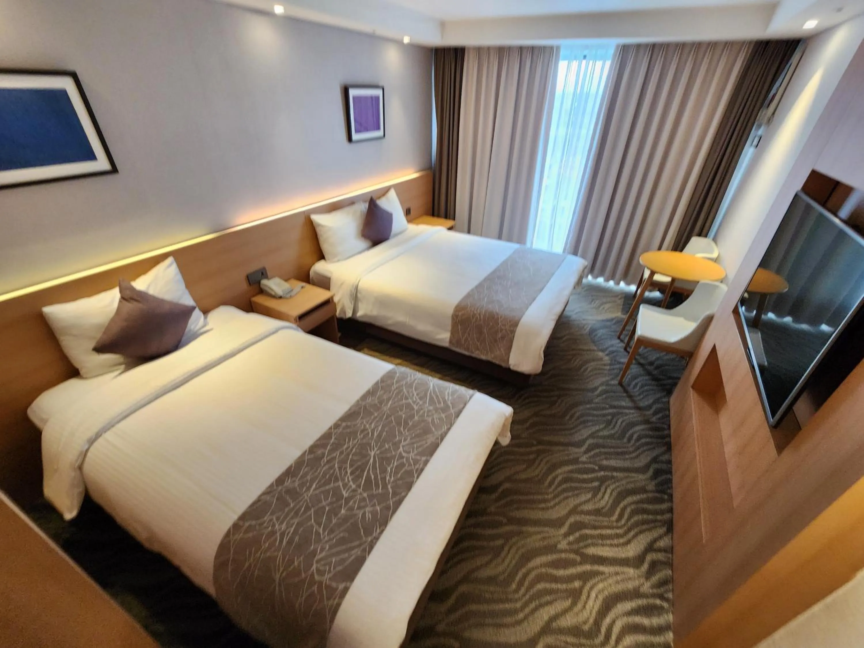 Bed in Seogwipo JS Hotel