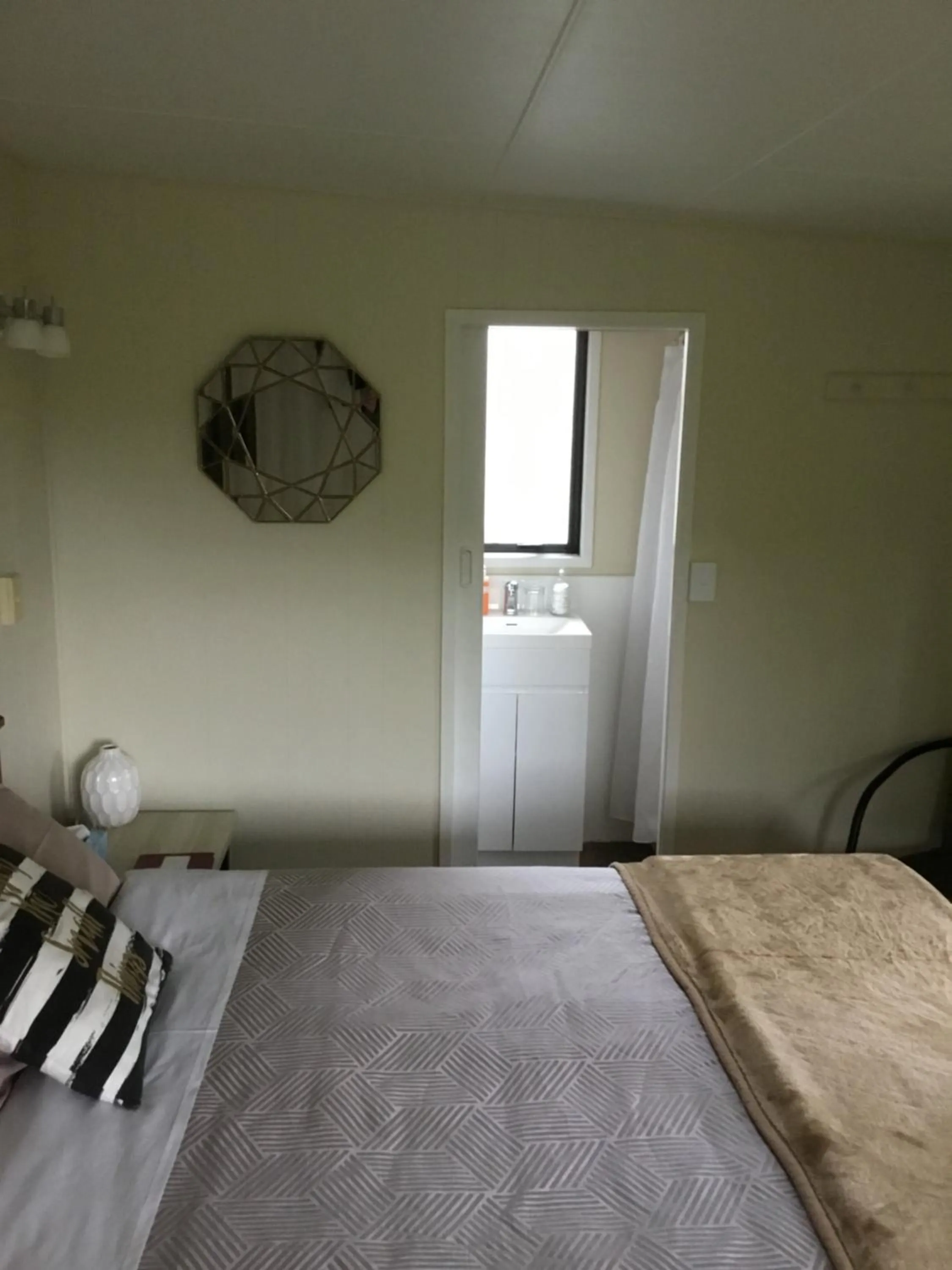 Bed in Waitomo Caves Guest Lodge