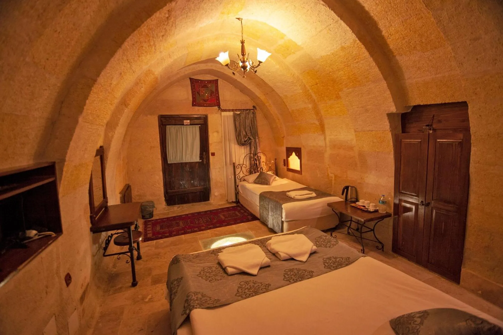 Photo of the whole room, Bed in Center Cave House