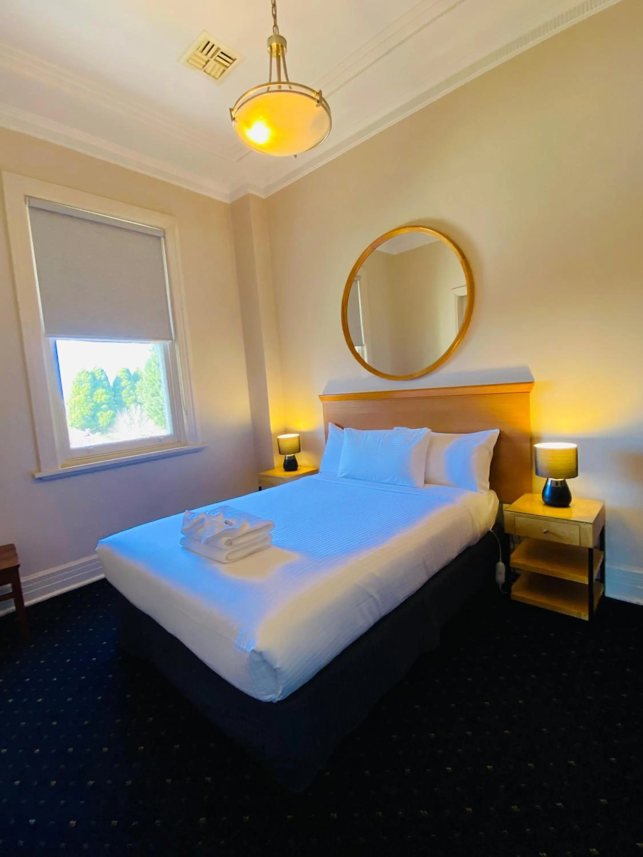 Bed in Gardners Inn Hotel