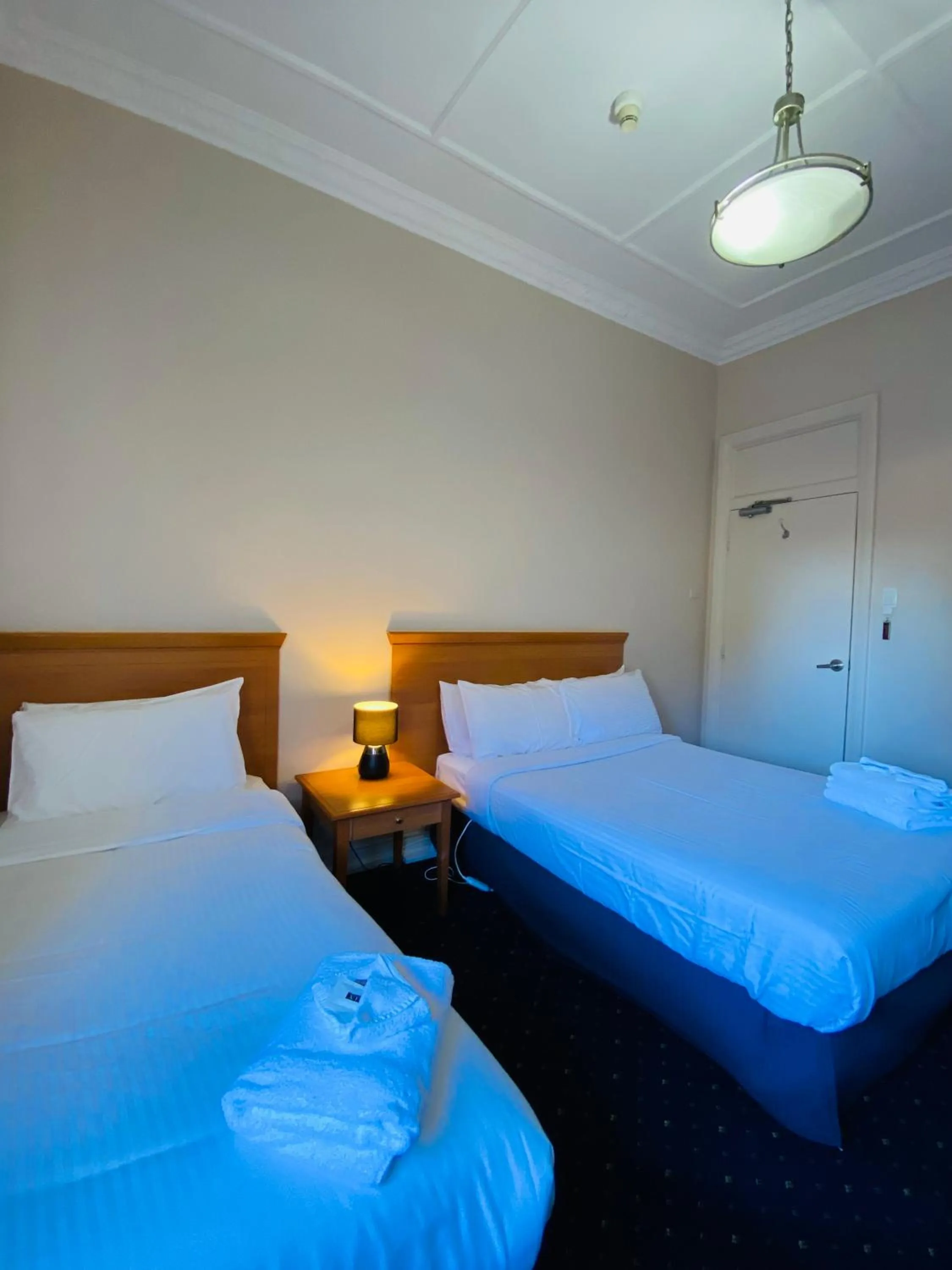 Bed in Gardners Inn Hotel