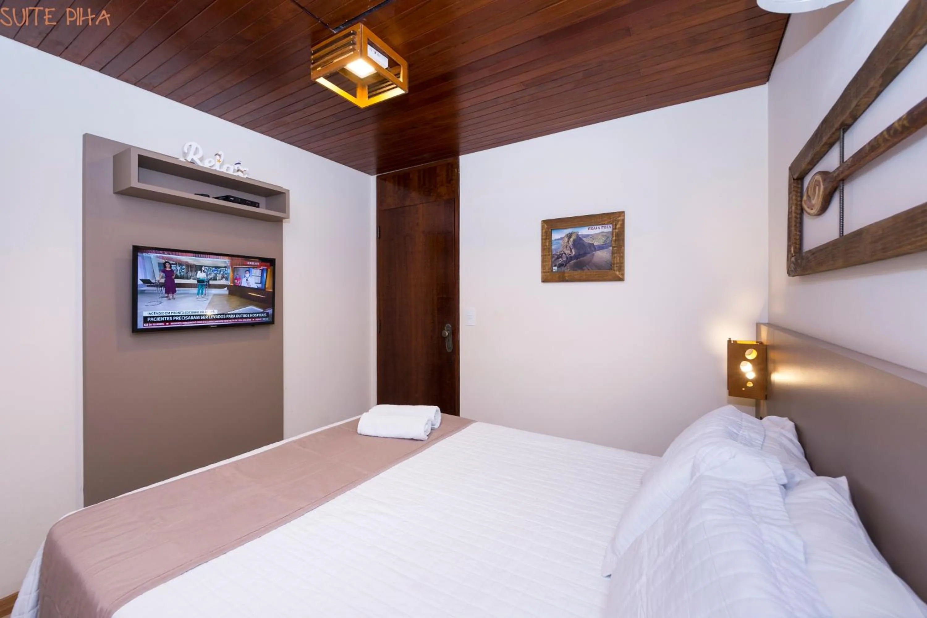 View (from property/room), Bed in Pousada Kia Ora Bombinhas