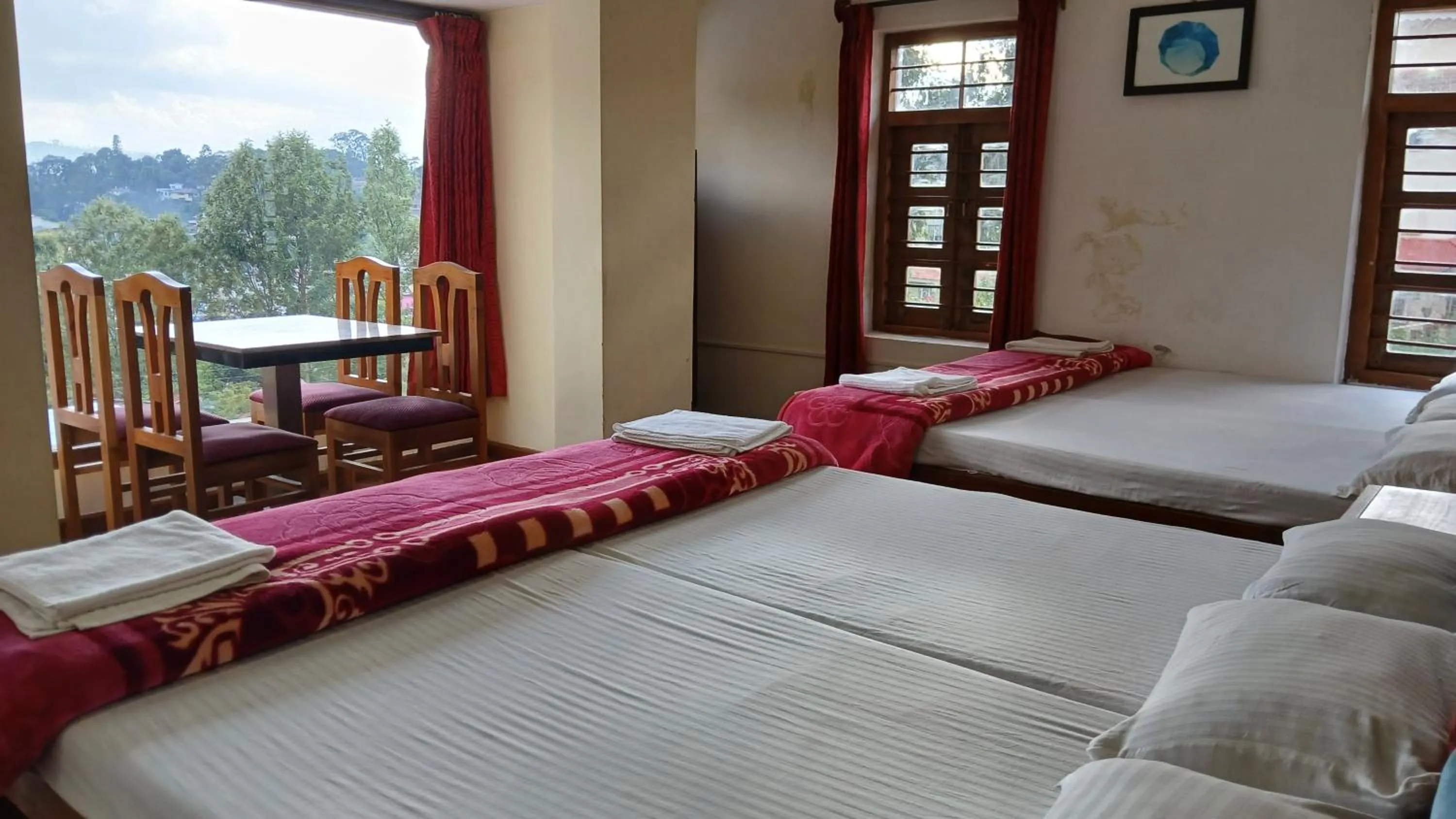 Bed in Satya Anand Cottage Pure Veg and Non Alcoholic Hotel