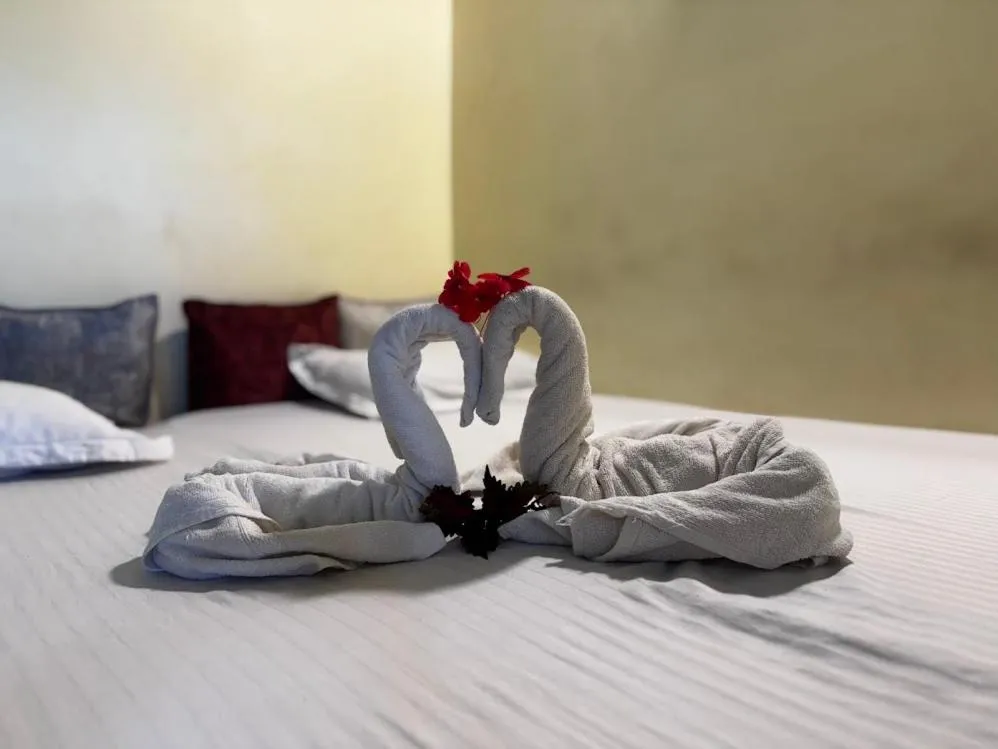 Bed in Satya Anand Cottage Pure Veg and Non Alcoholic Hotel