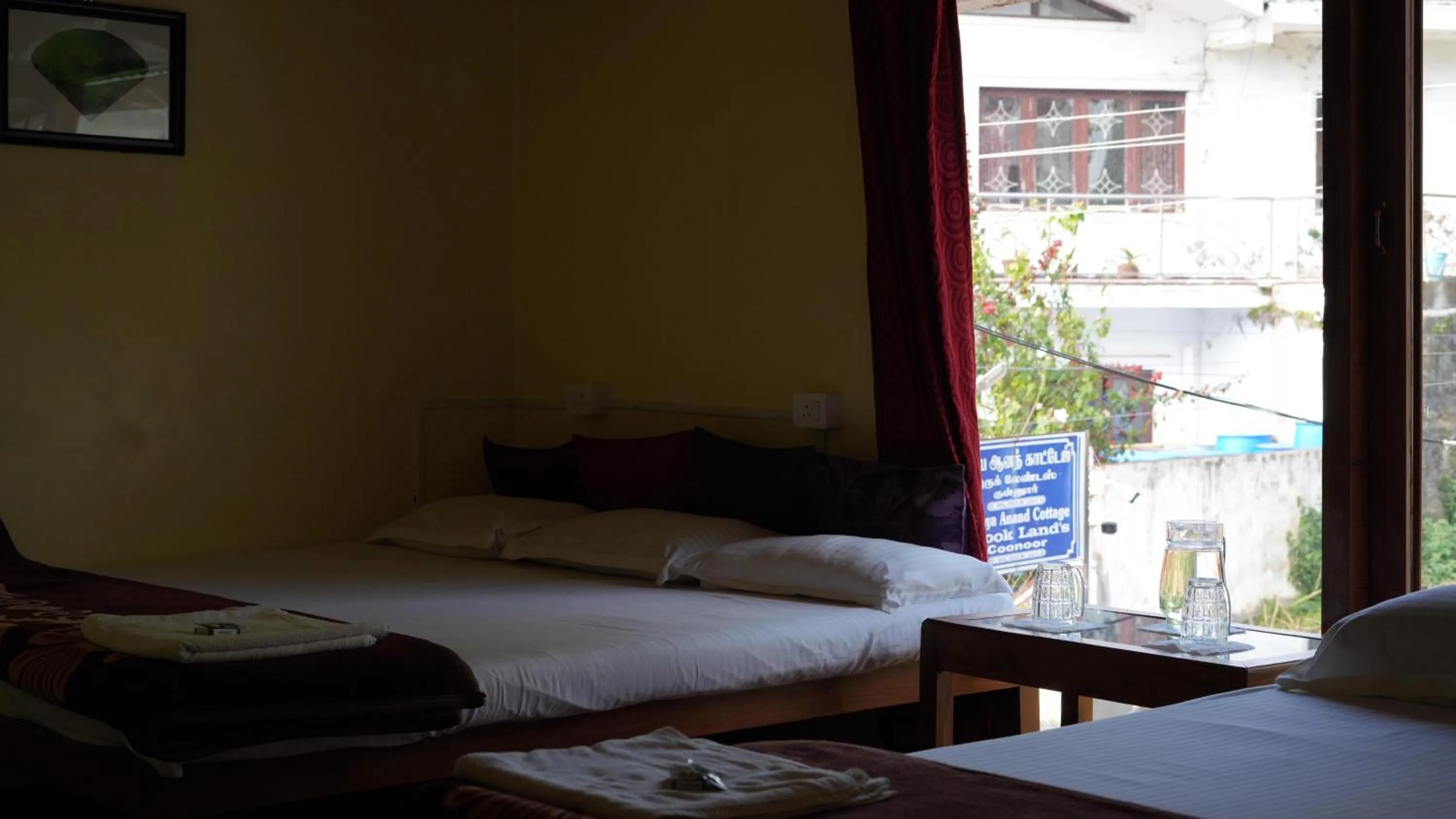 Bed in Satya Anand Cottage Pure Veg and Non Alcoholic Hotel