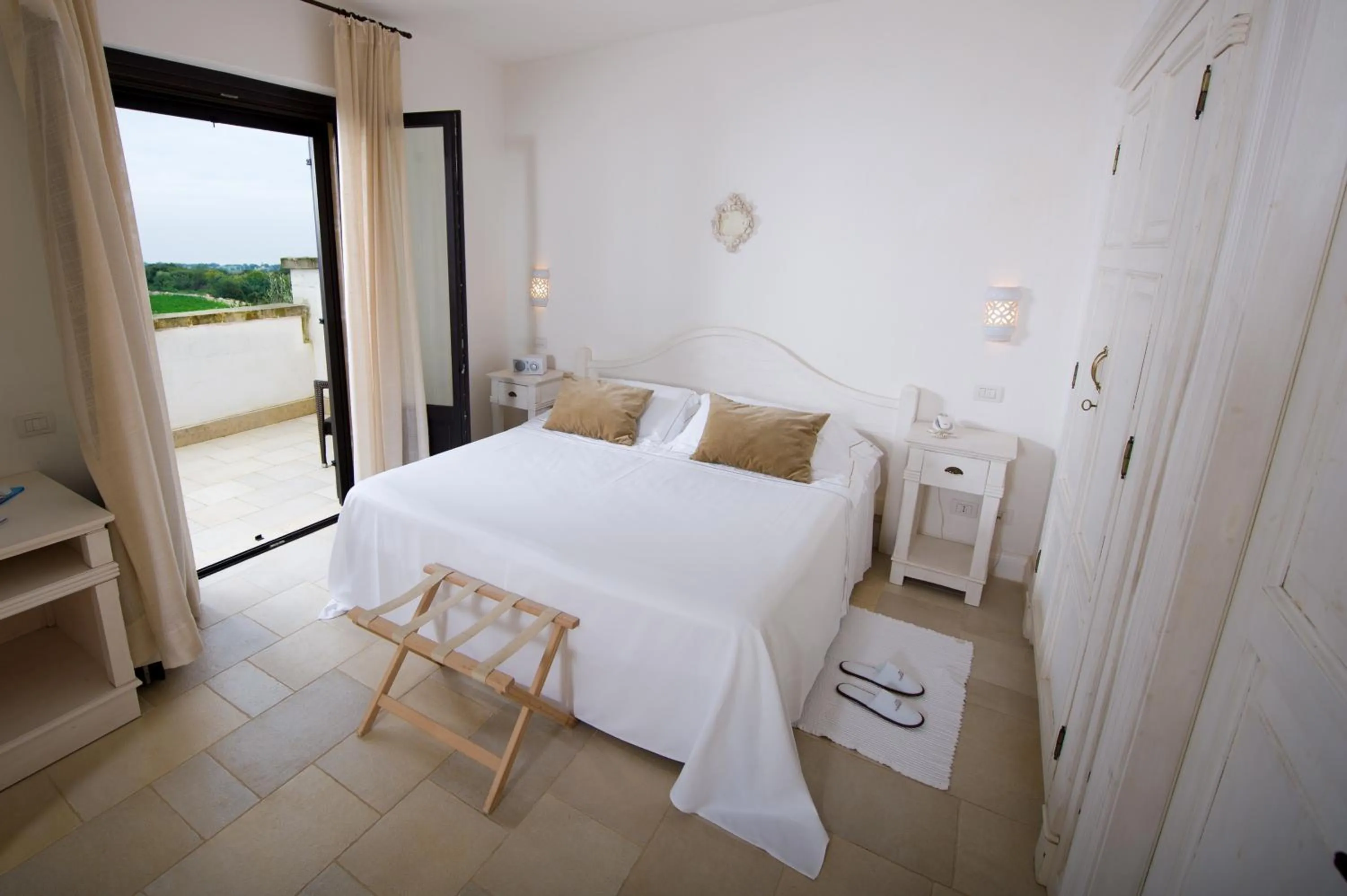 Photo of the whole room, Bed in Borgobianco Resort & Spa Polignano - MGallery Collection