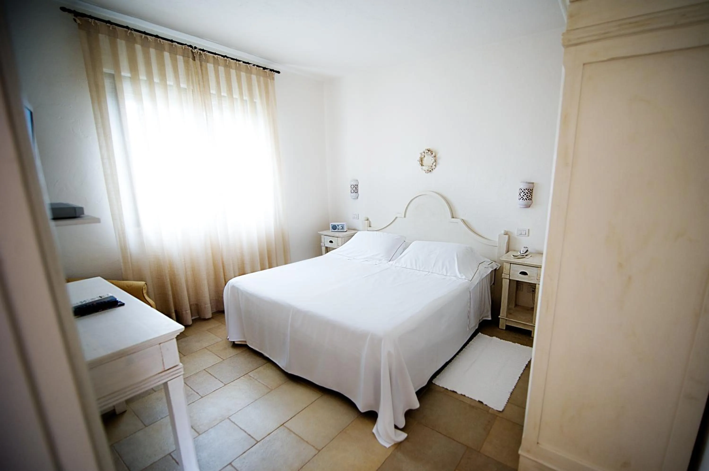 Photo of the whole room, Bed in Borgobianco Resort & Spa Polignano - MGallery Collection