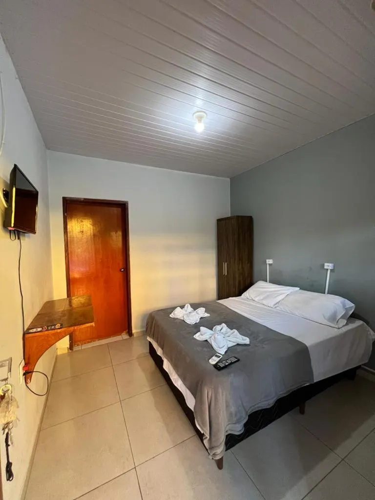 Bed in Pousada Rio Bonito