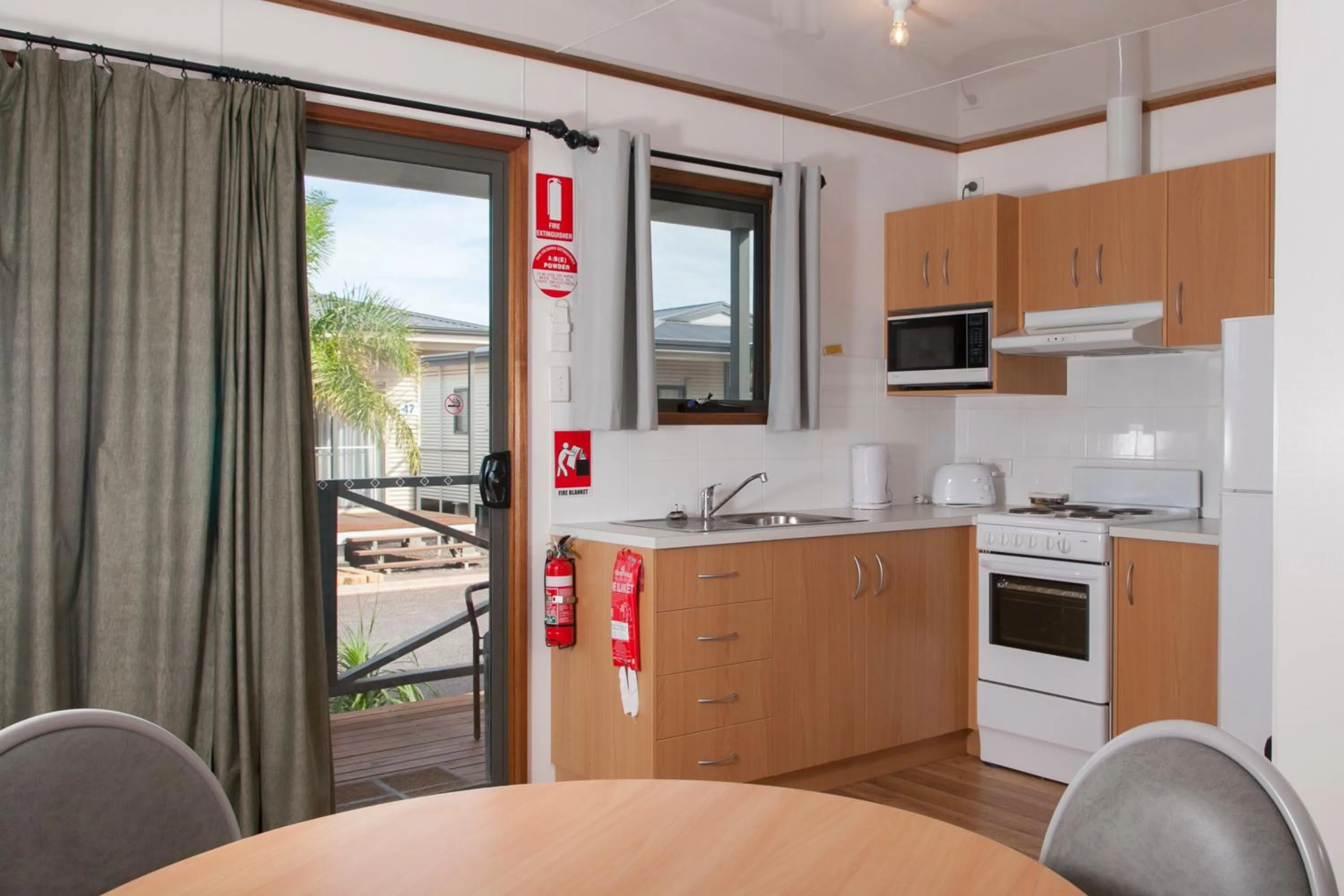 Kitchen or kitchenette in The Sundowner Cabin & Tourist Park