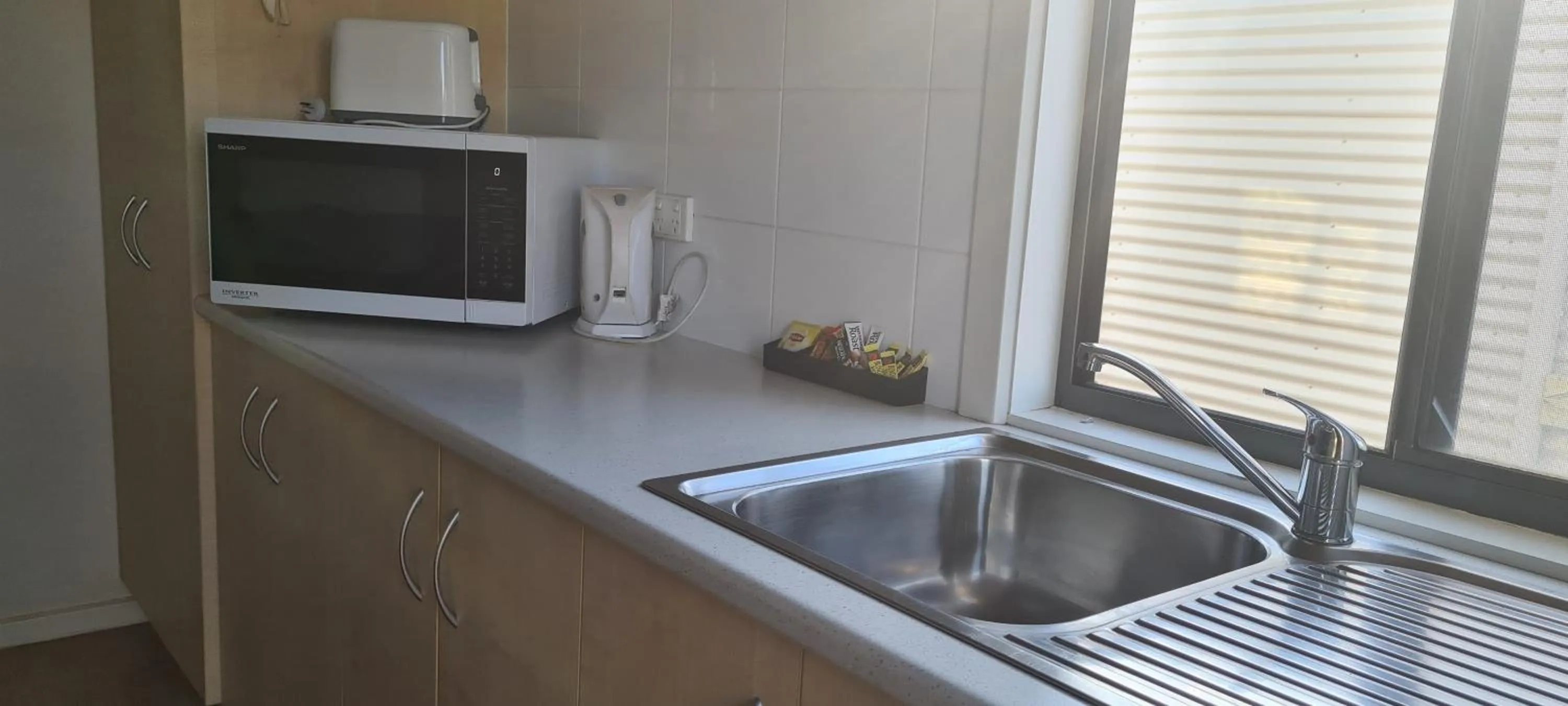 Kitchen or kitchenette in The Sundowner Cabin & Tourist Park