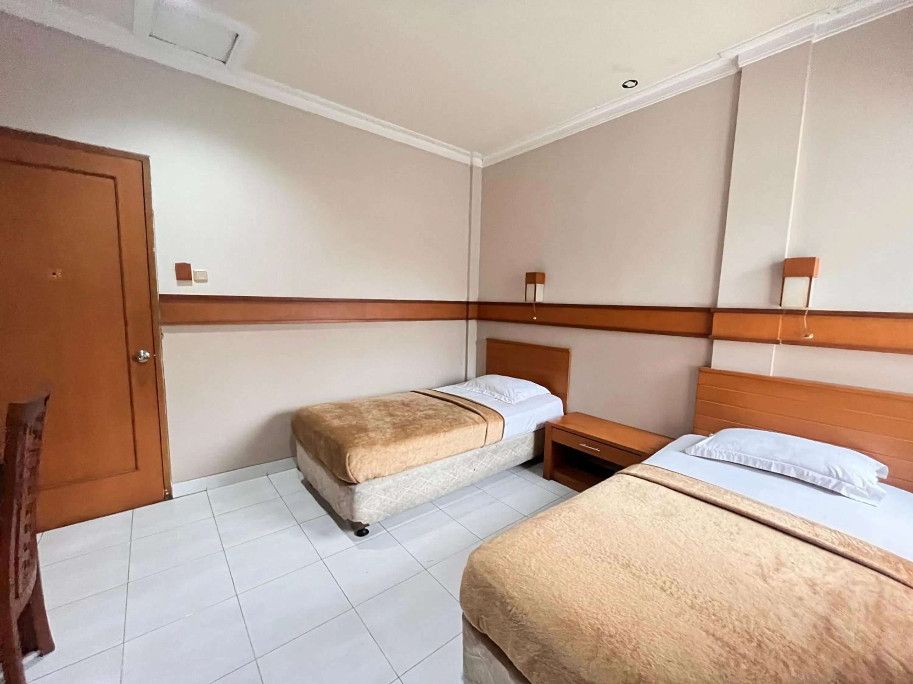 Bed in Hotel Caravan Tanah Abang