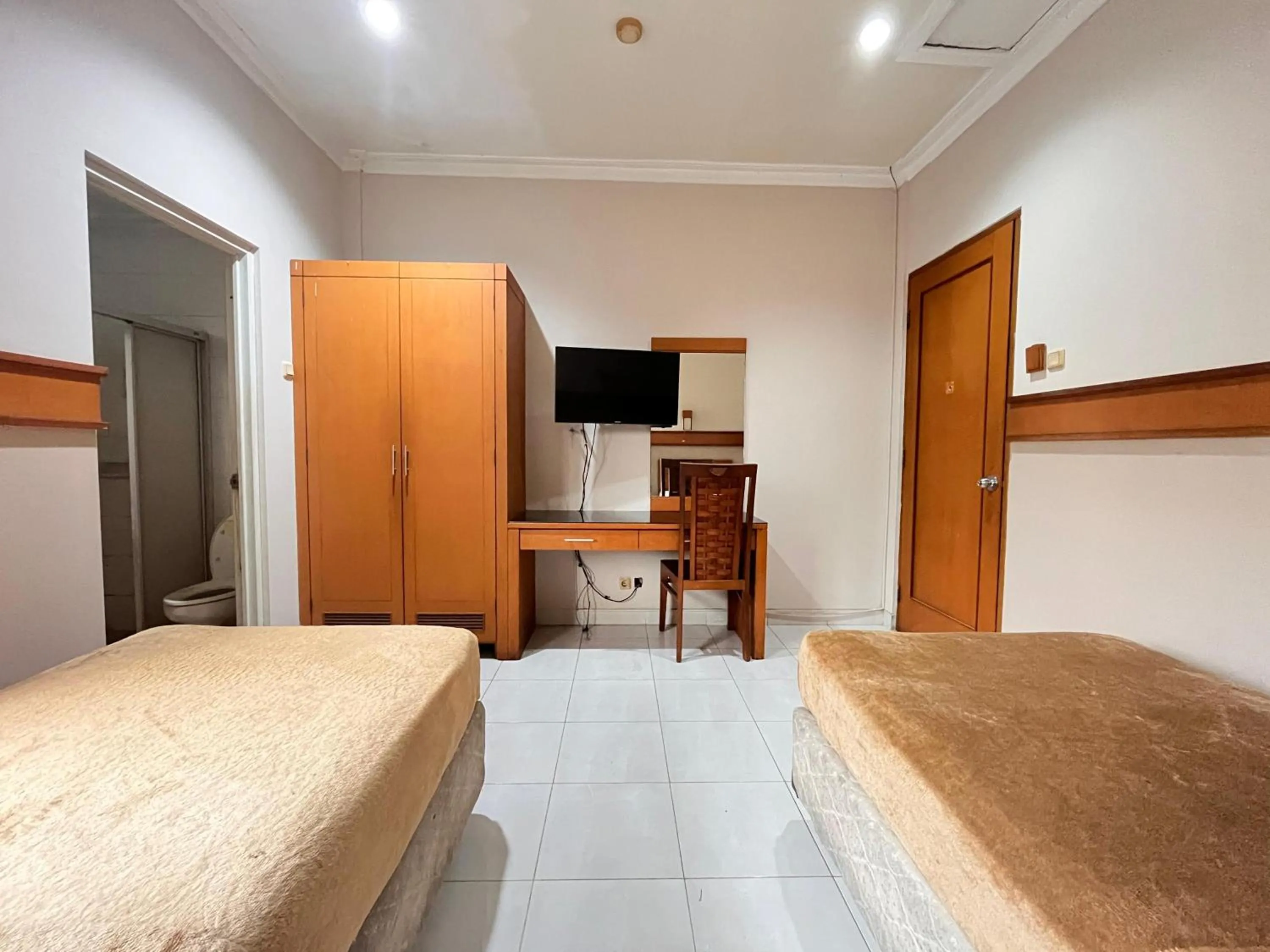 Bed in Hotel Caravan Tanah Abang