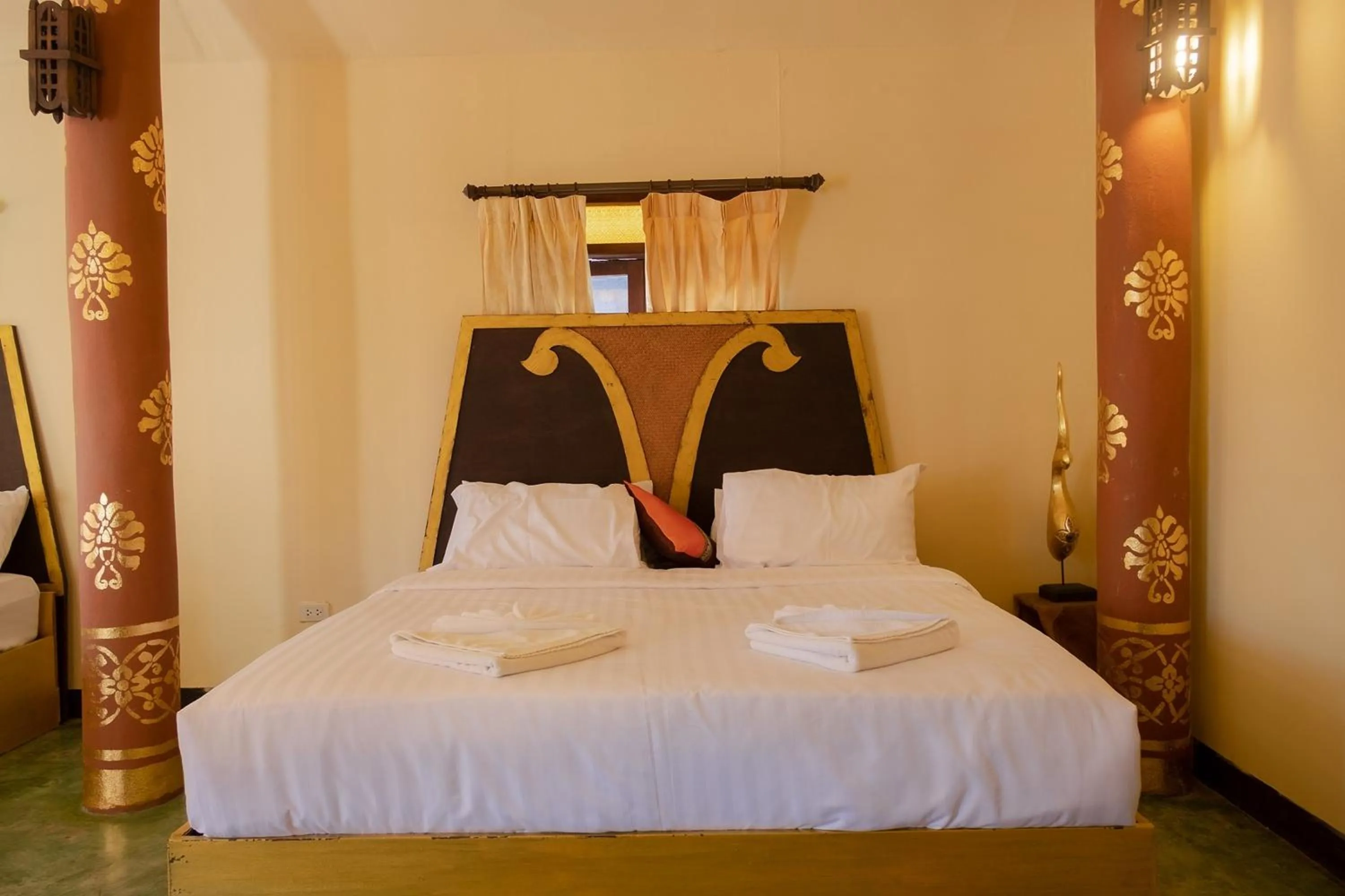 Bed in Baan Tawai Lanna Resort