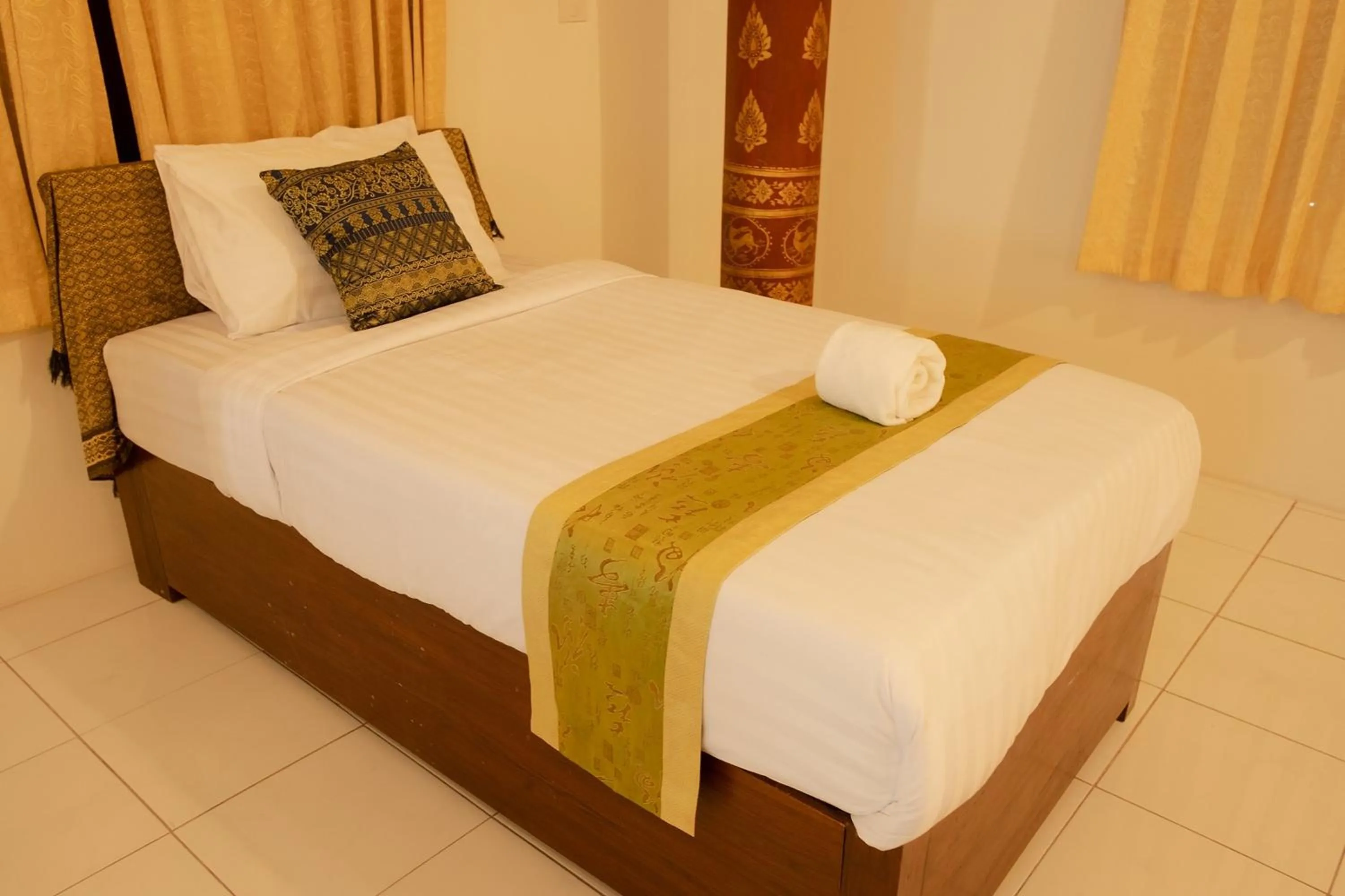 Bed in Baan Tawai Lanna Resort