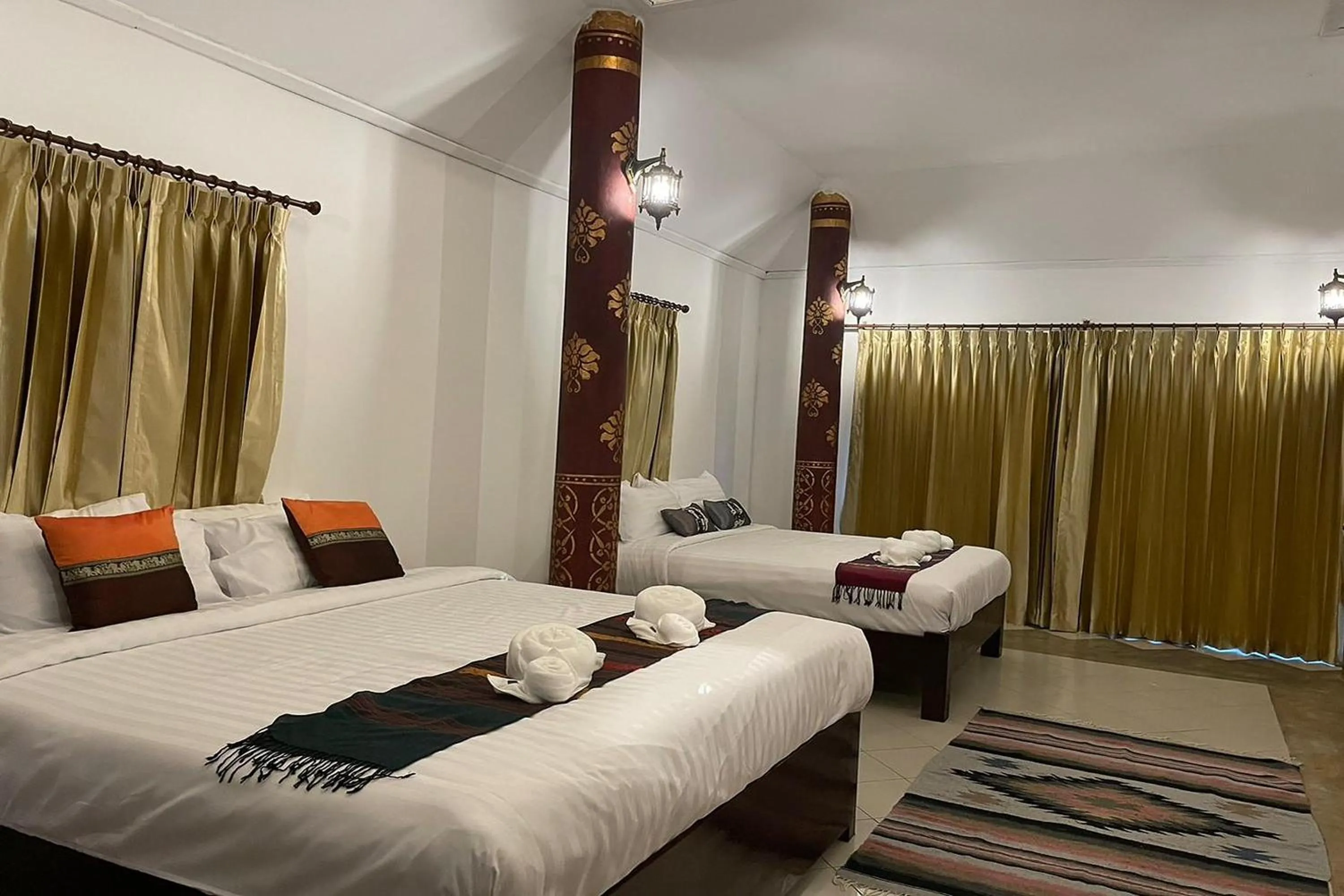 Bed in Baan Tawai Lanna Resort