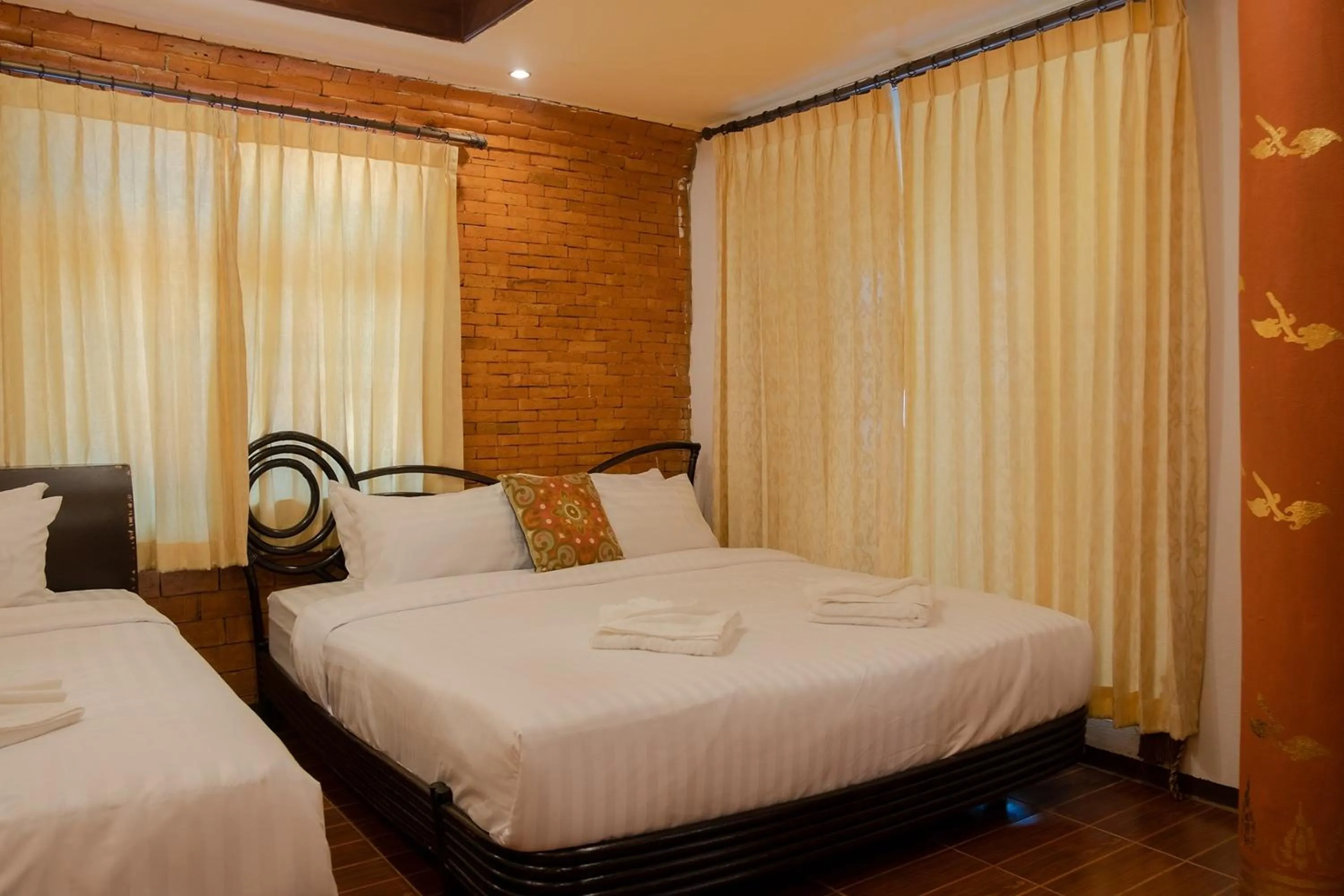 Bed in Baan Tawai Lanna Resort