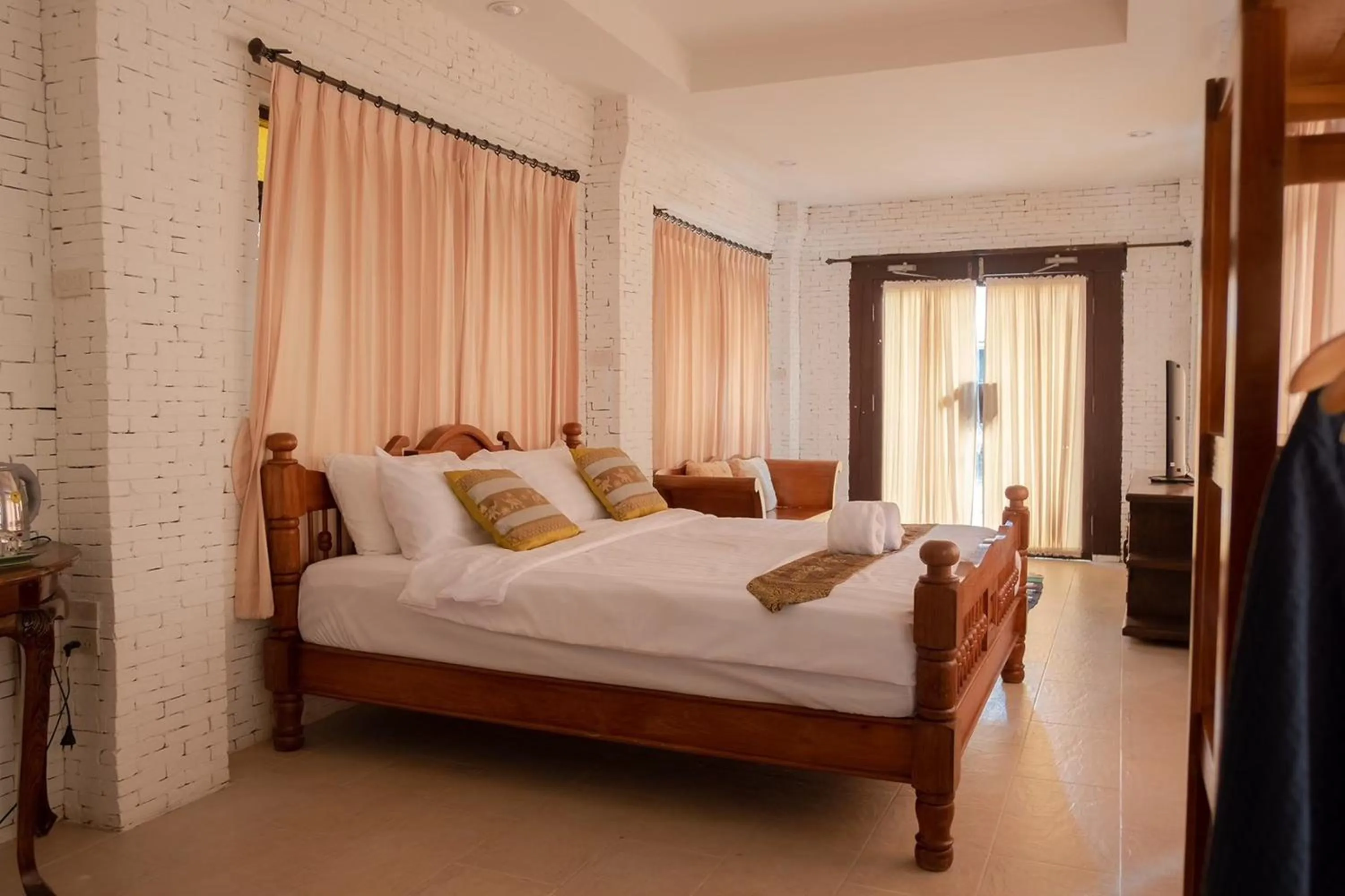 Bed in Baan Tawai Lanna Resort