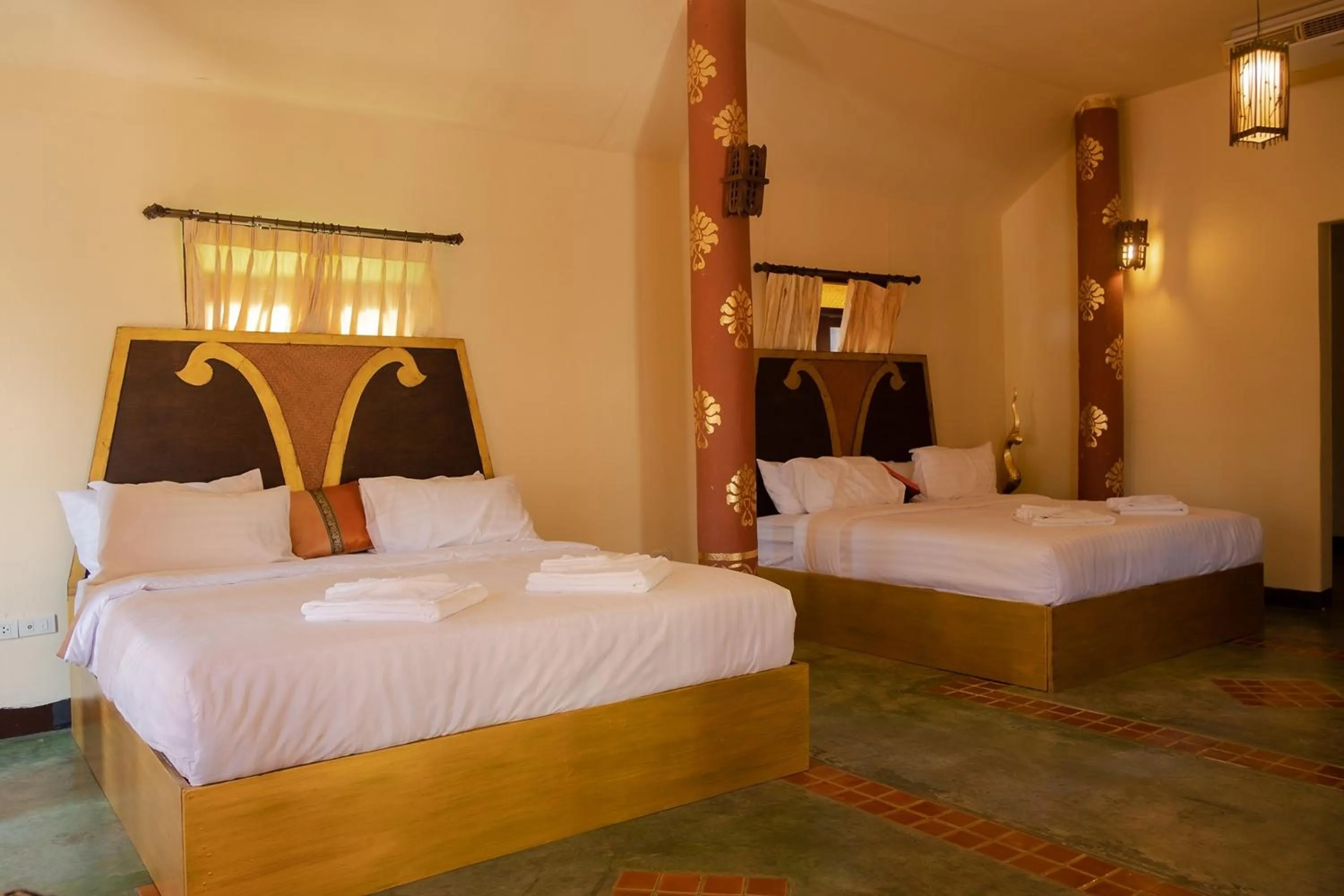 Bed in Baan Tawai Lanna Resort