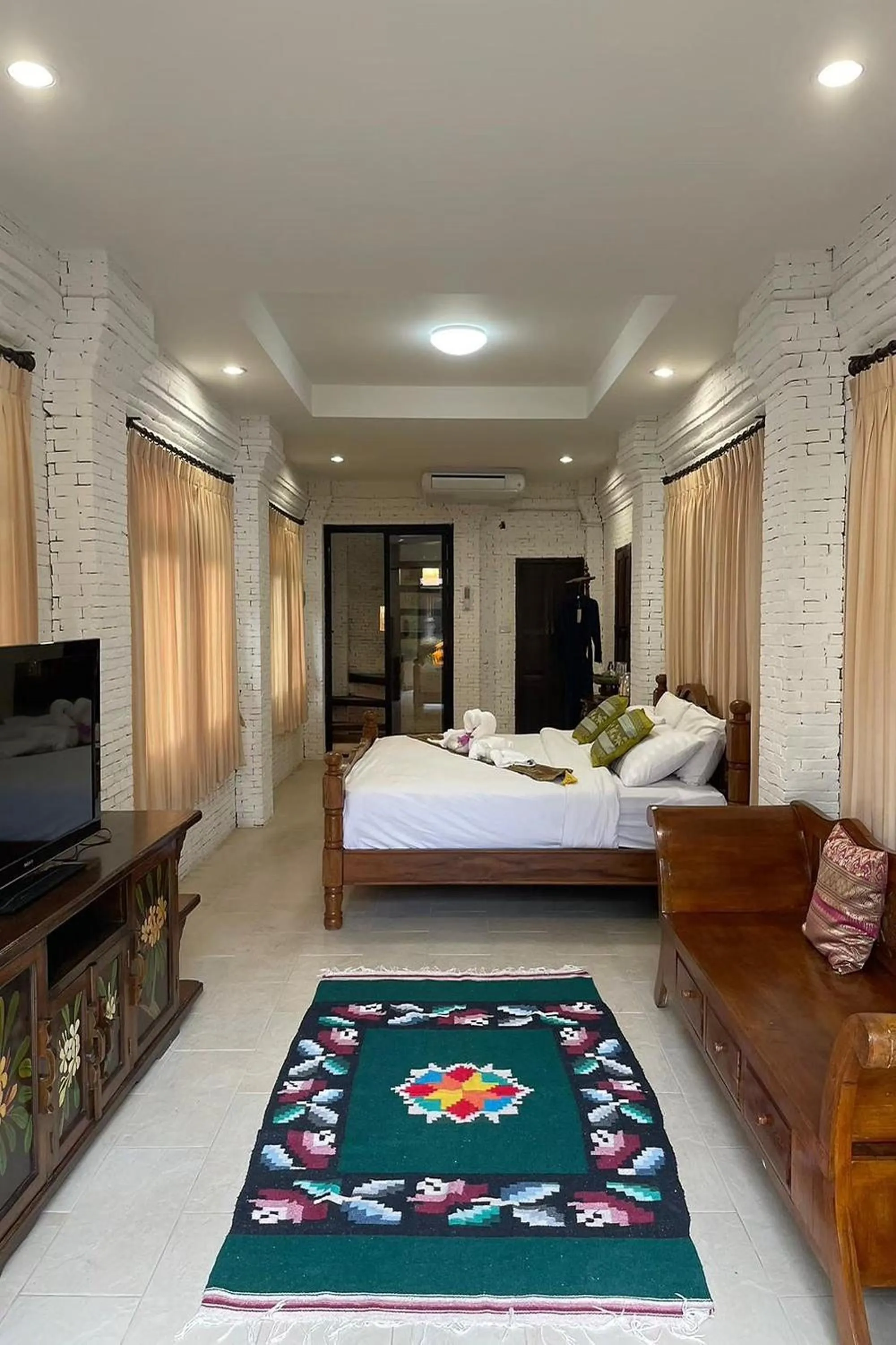 Bed in Baan Tawai Lanna Resort