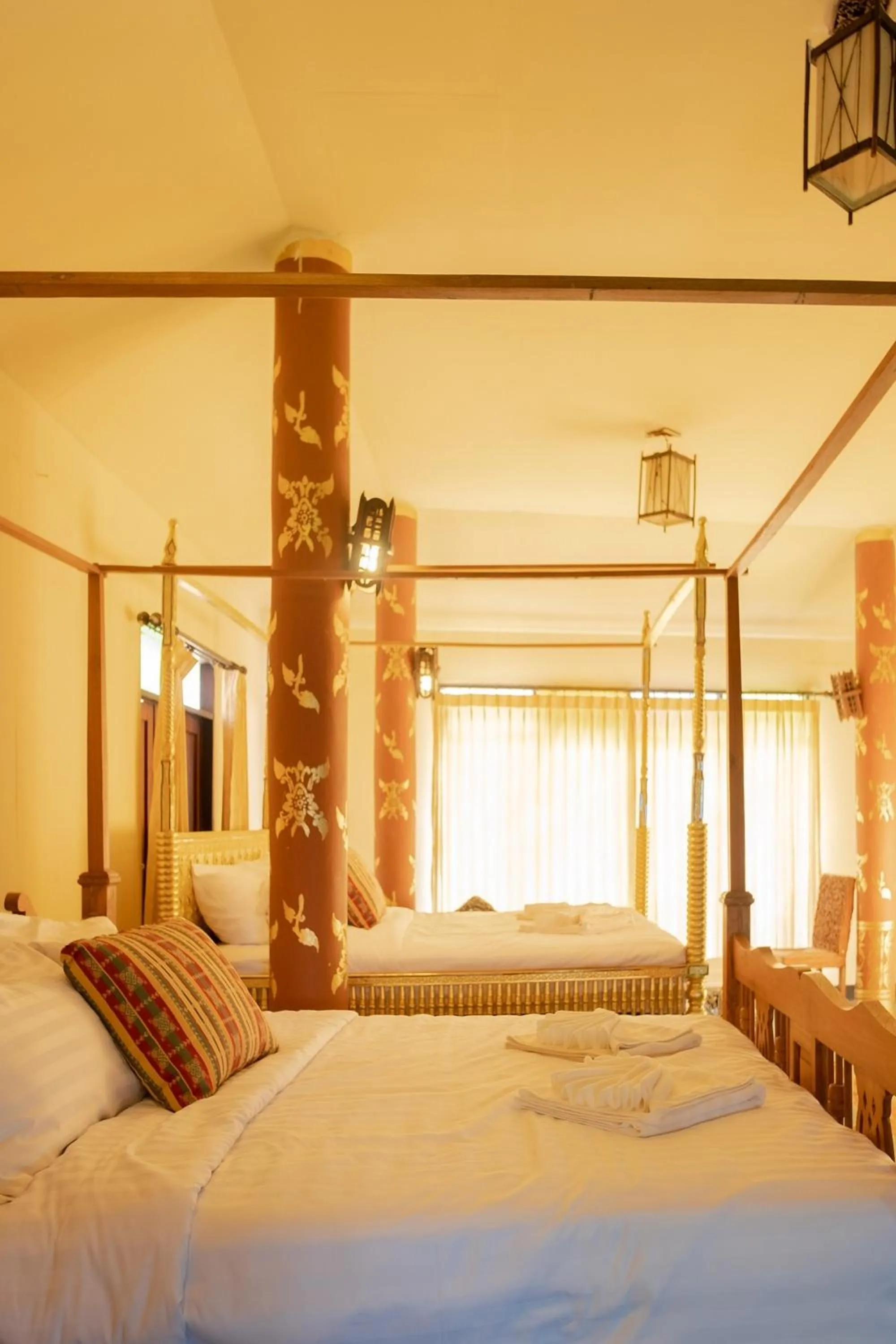 Bed in Baan Tawai Lanna Resort