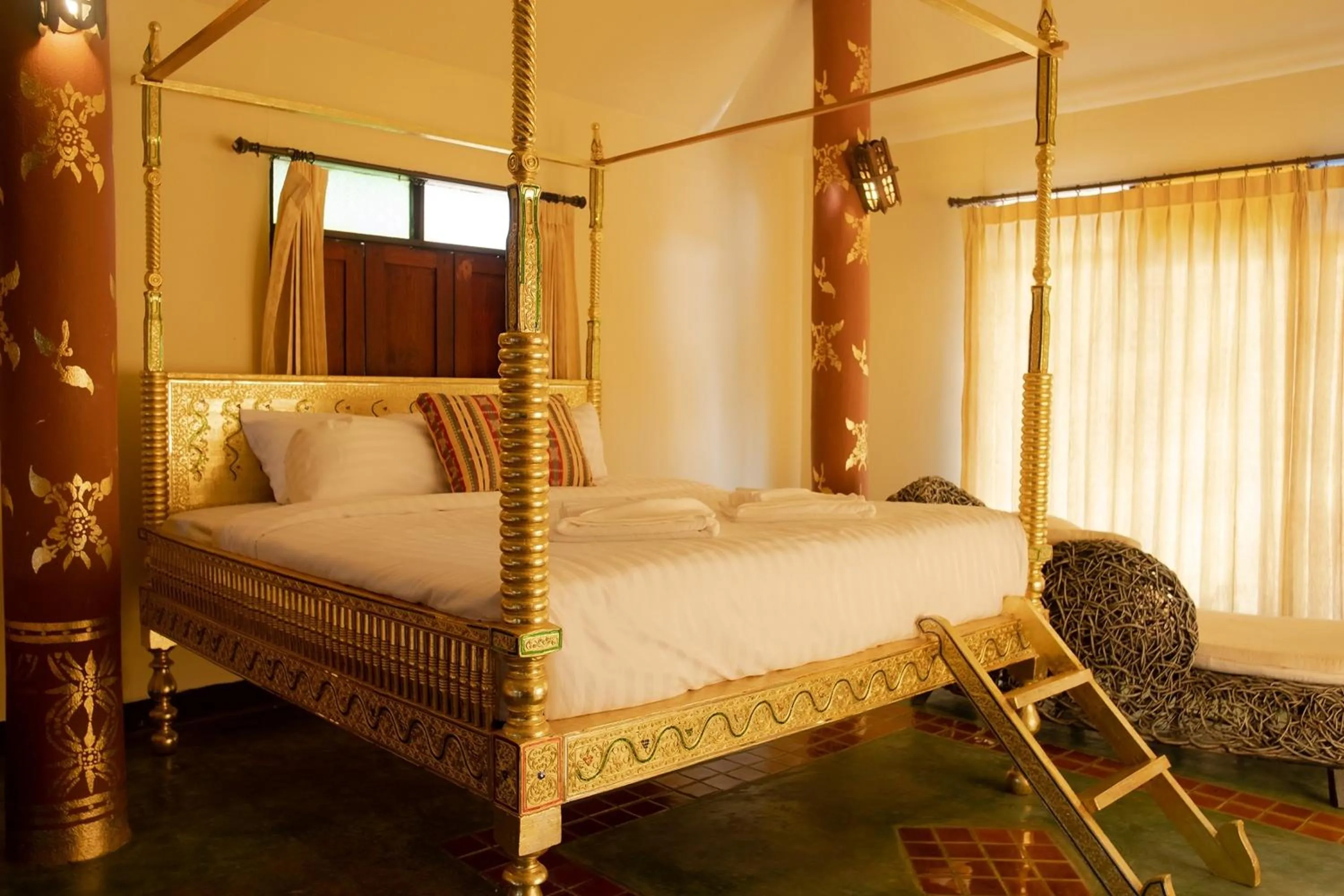 Bed in Baan Tawai Lanna Resort