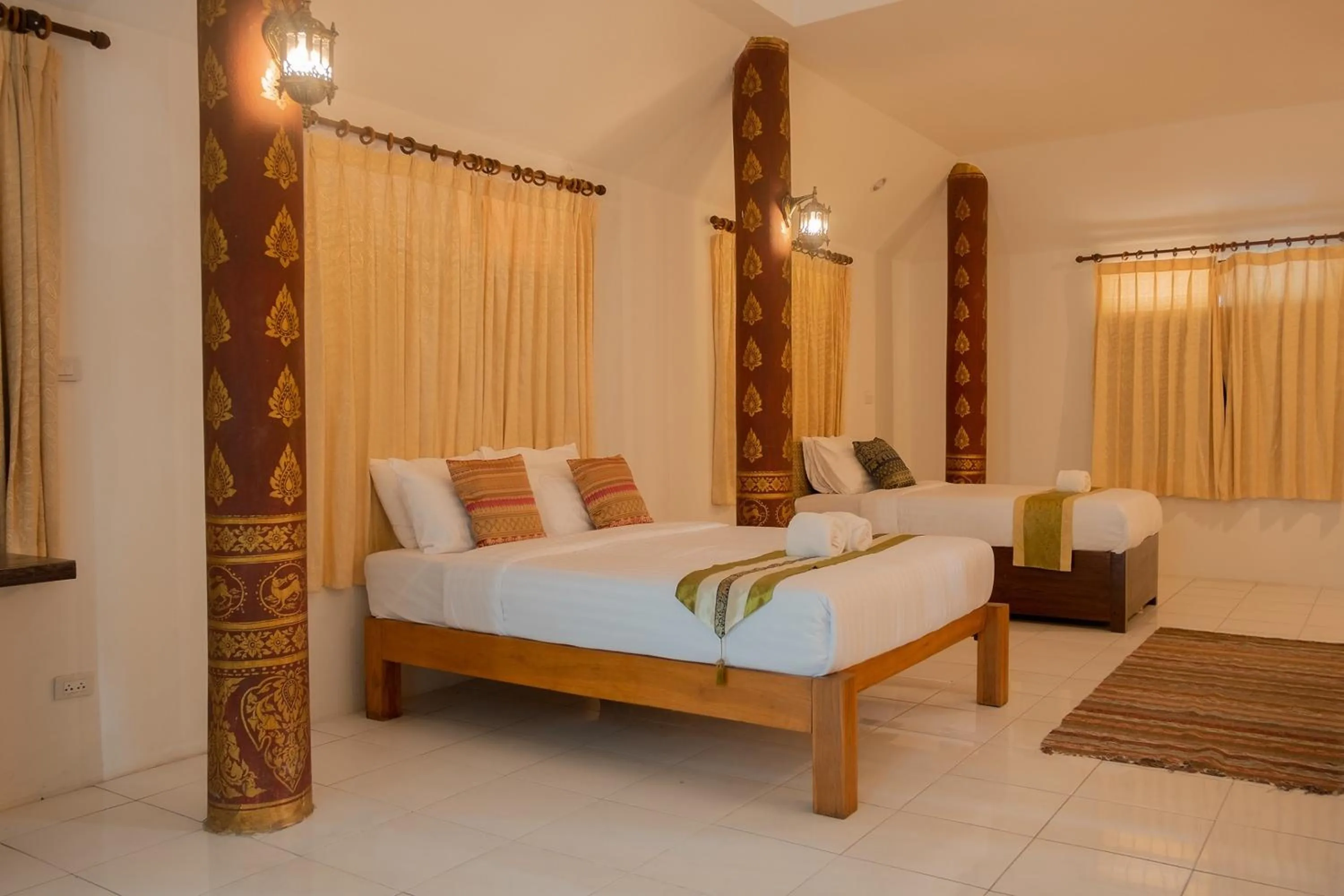Bed in Baan Tawai Lanna Resort