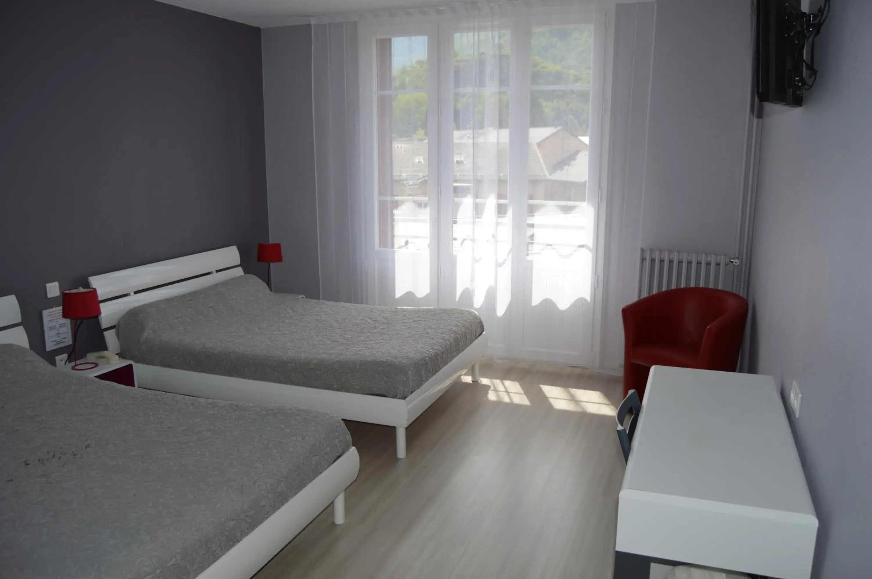 Classic Quadruple Room in Hôtel Le Bellevue Classic Quadruple Room in Hôtel Le Bellevue