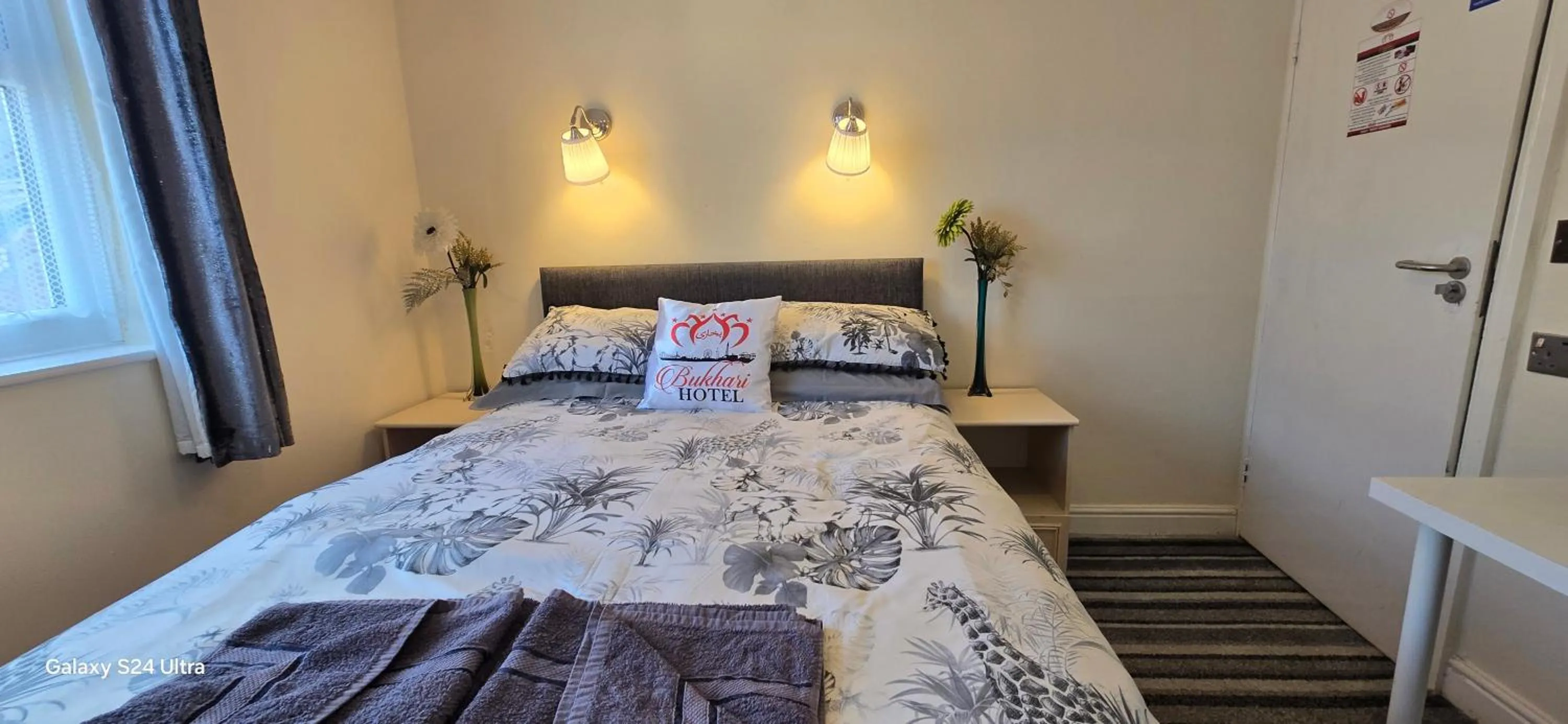 Bed in BUKHARI Hotel