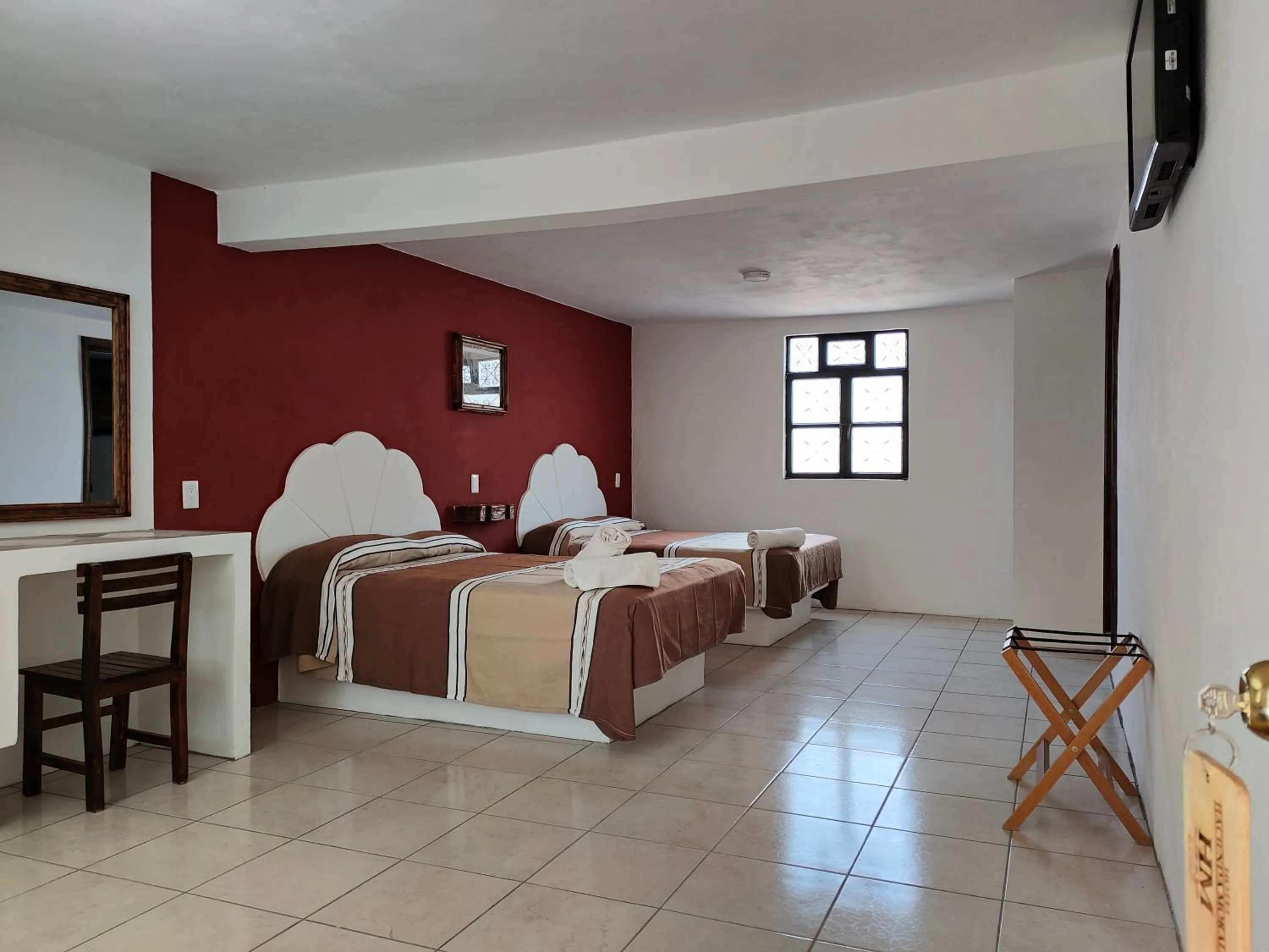 Bed in Hotel Hacienda Morales.