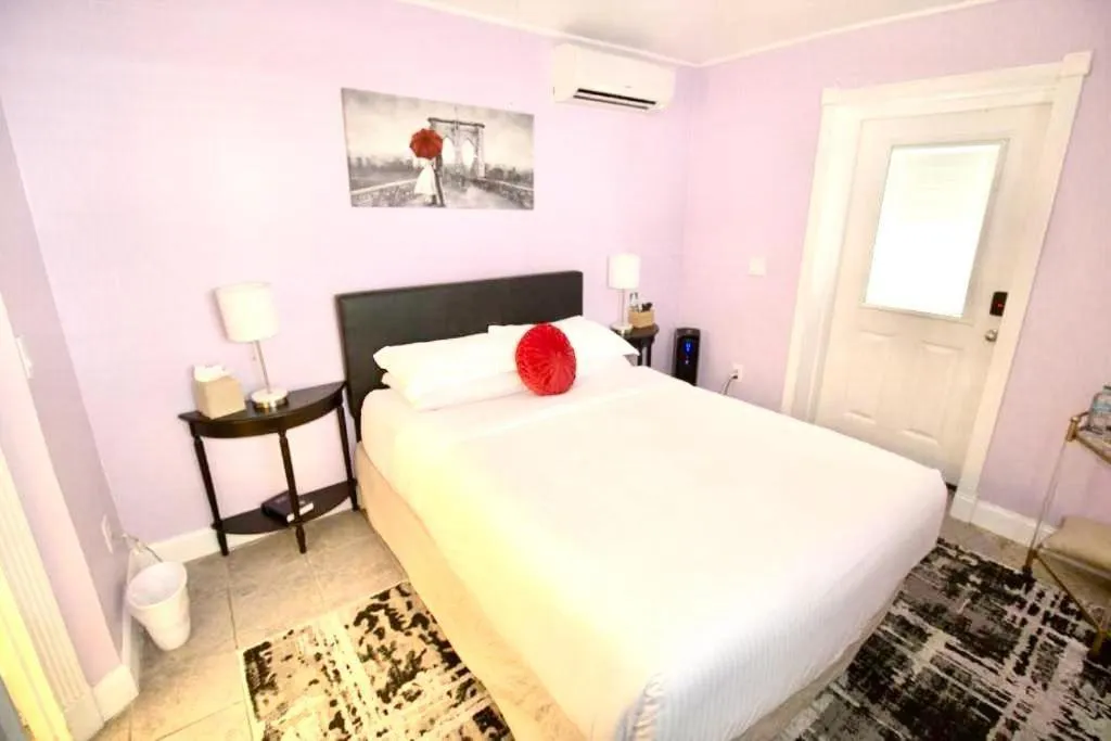 Bed in Inn on Charlotte Boutique Hotel