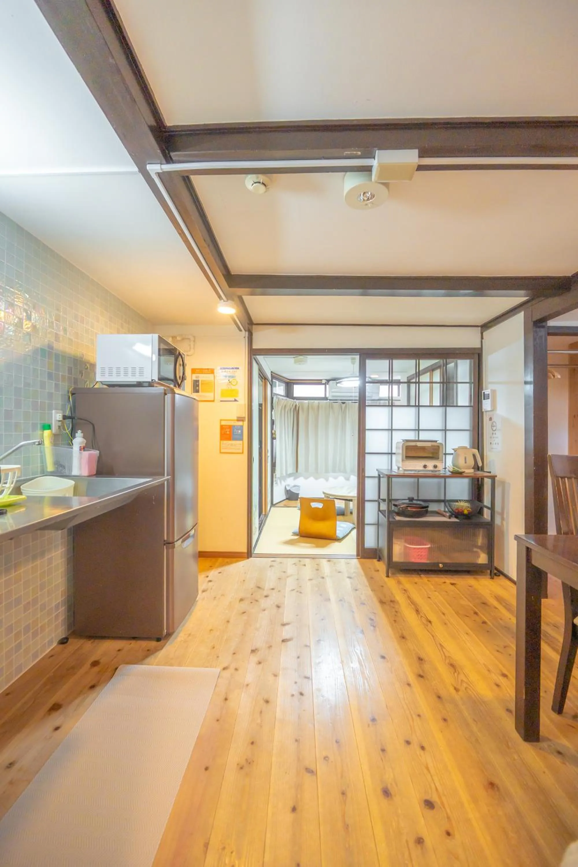 Kitchen or kitchenette, Bed in Guest house Connection Karasuma Gojo