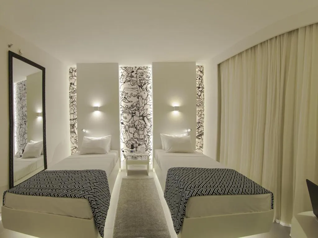 Bed in Golden Tower Maracanaú by Fênix Hotéis